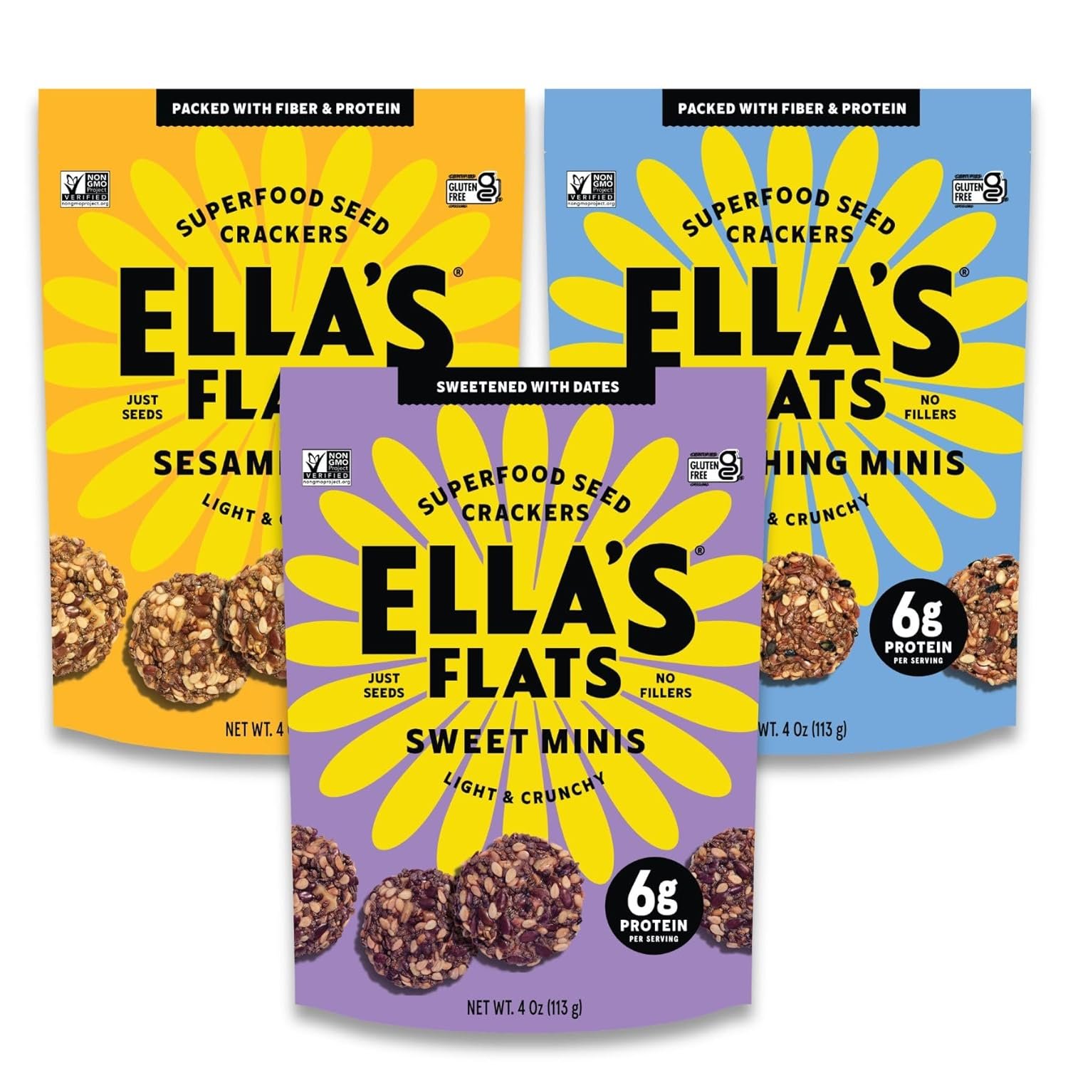 Three colorful bags of Ella's Flats superfood seed crackers, each featuring a different flavor: sesame, sweet minis, and onion minis, with images of the crackers and nutritional information on the packaging.