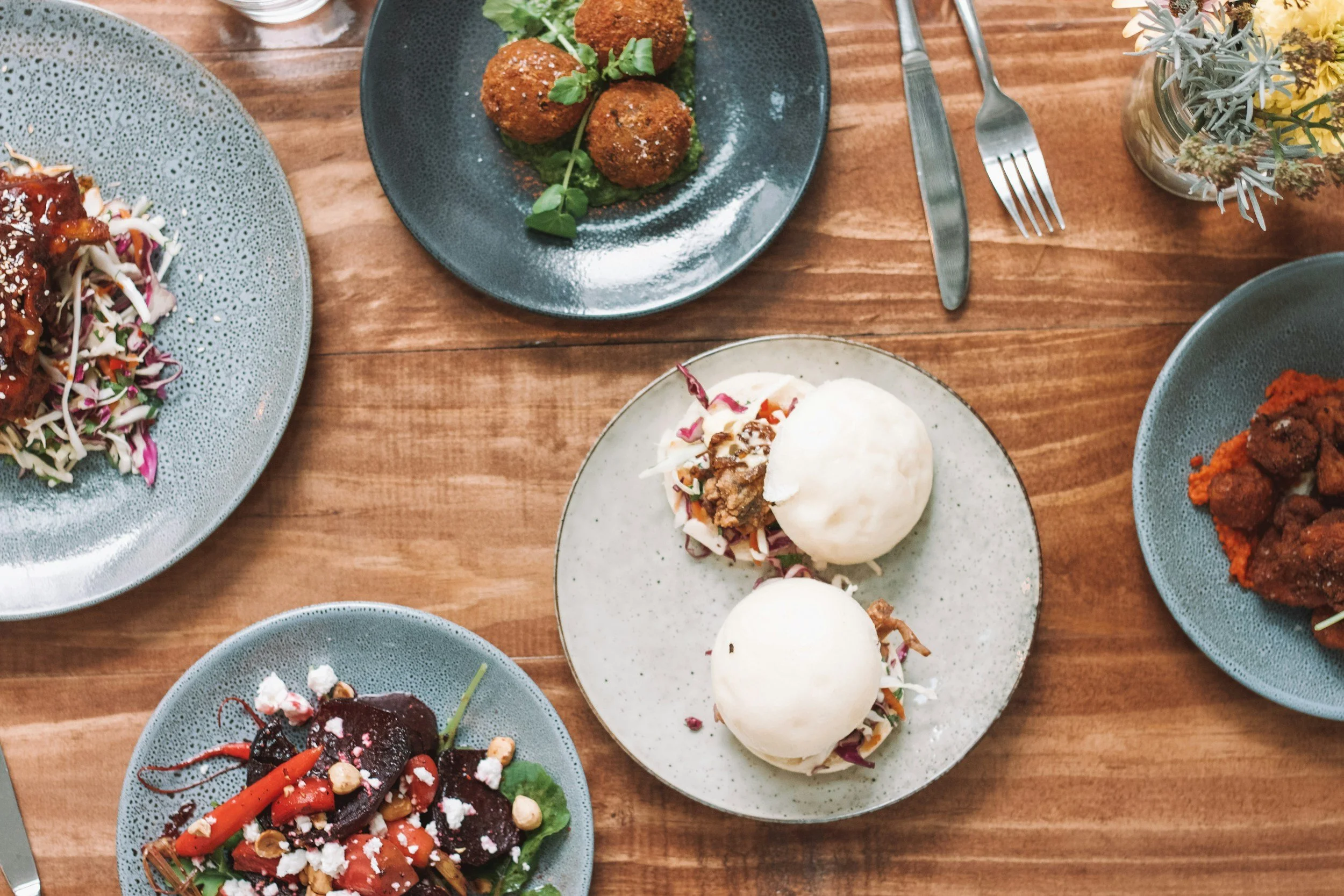 plates of tapas on a wooden table