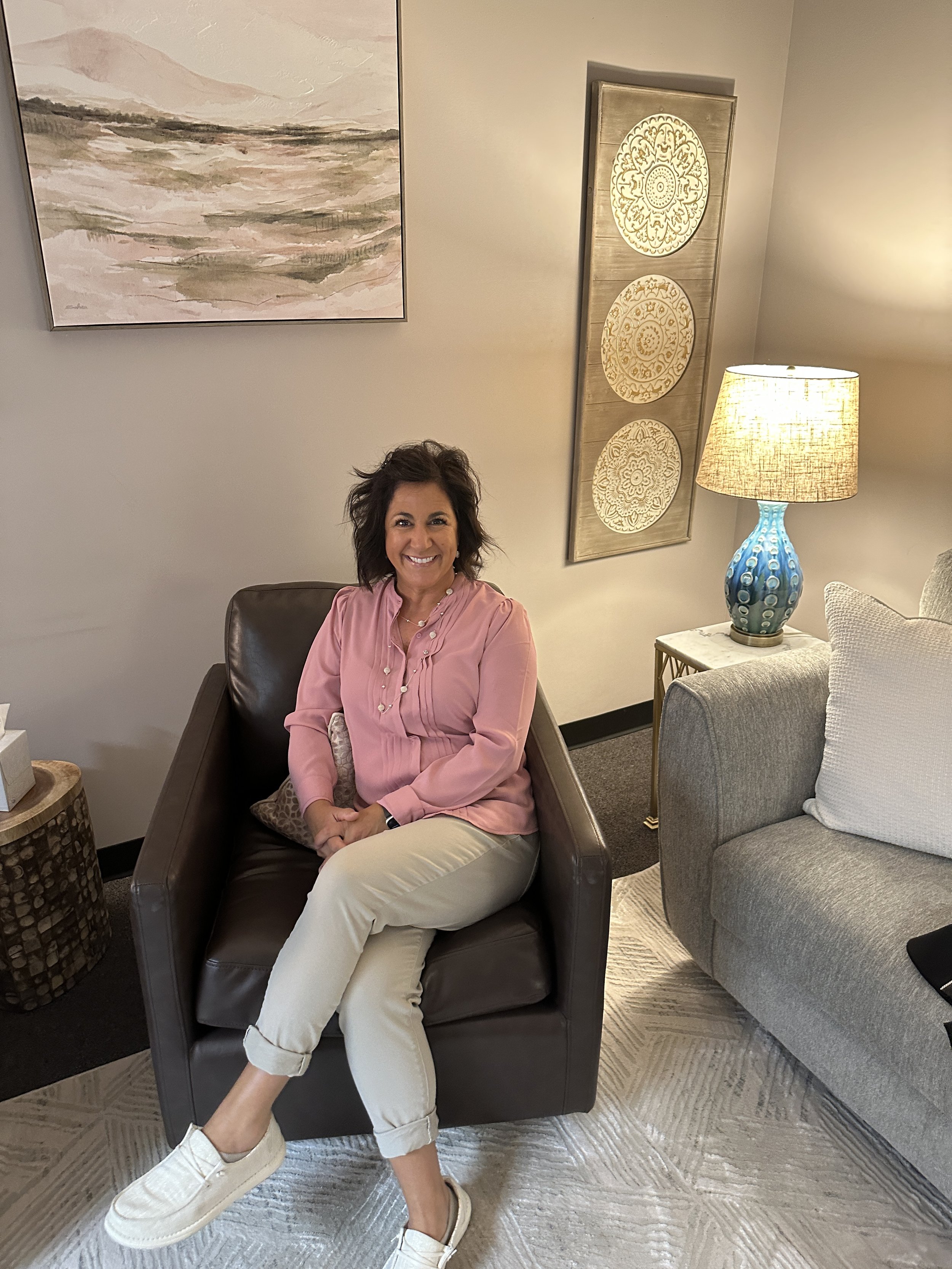 Diane Peters, Psy.D., seated in her office at Bryan Psychological Services