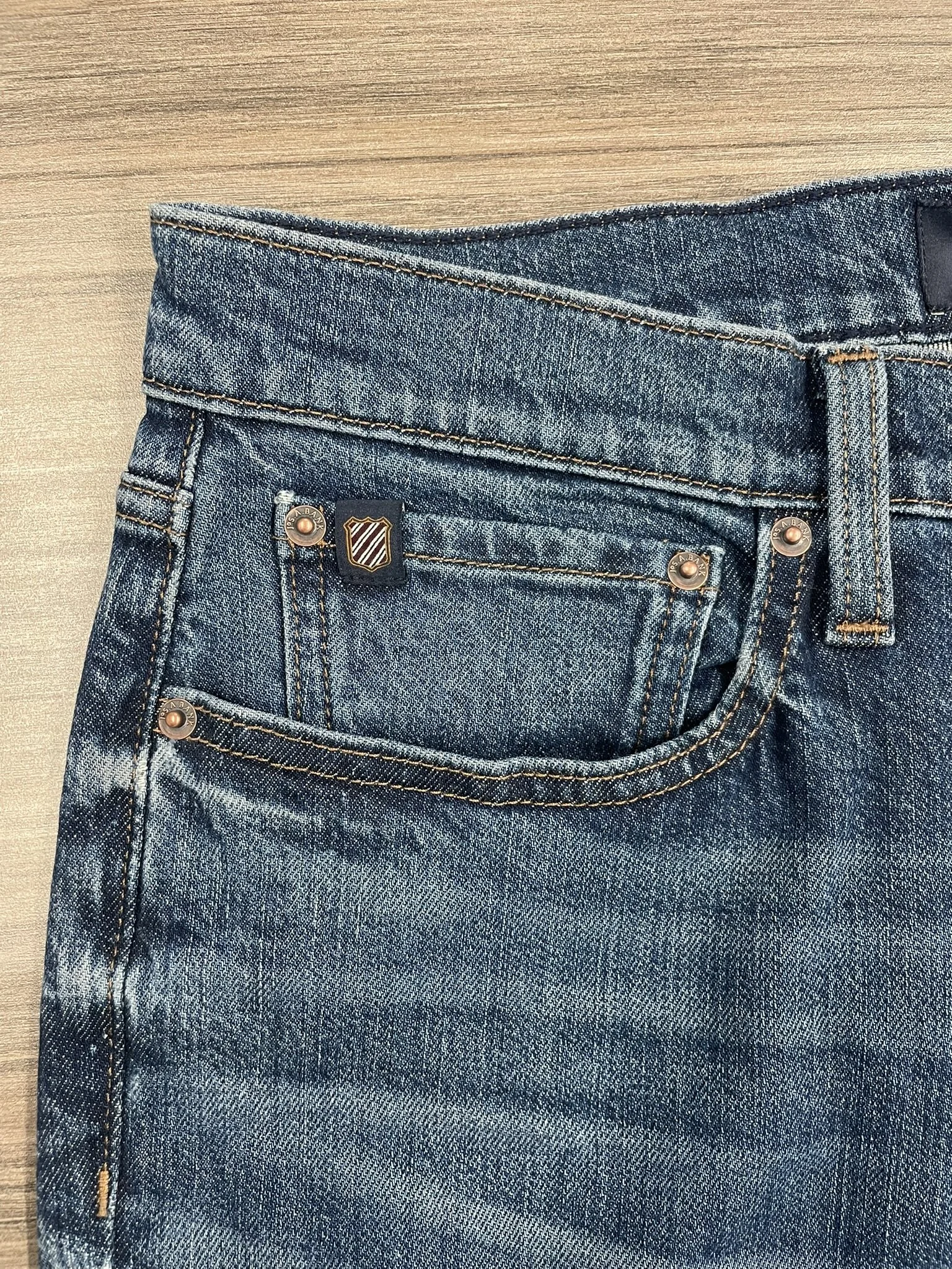 Coin pocket redesign featuring shield clamp and new rivet finishes