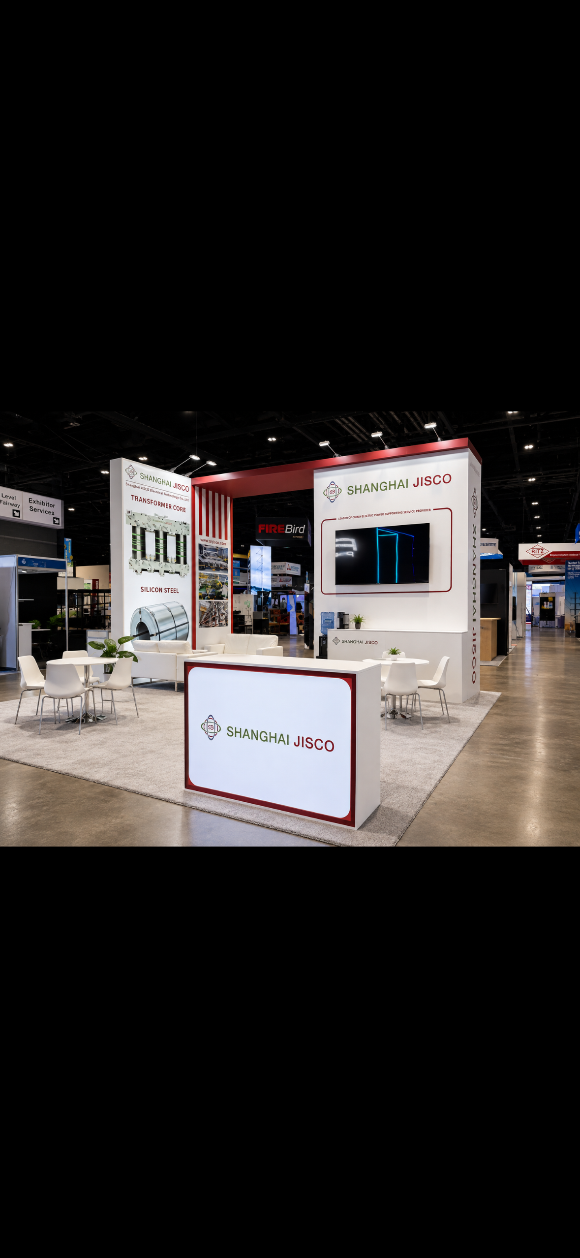 Trade show booth for Shanghai Jisco with white and red branding, featuring a display for transformer core and silicon steel, sitting area with white chairs and tables, large screen, and signage.