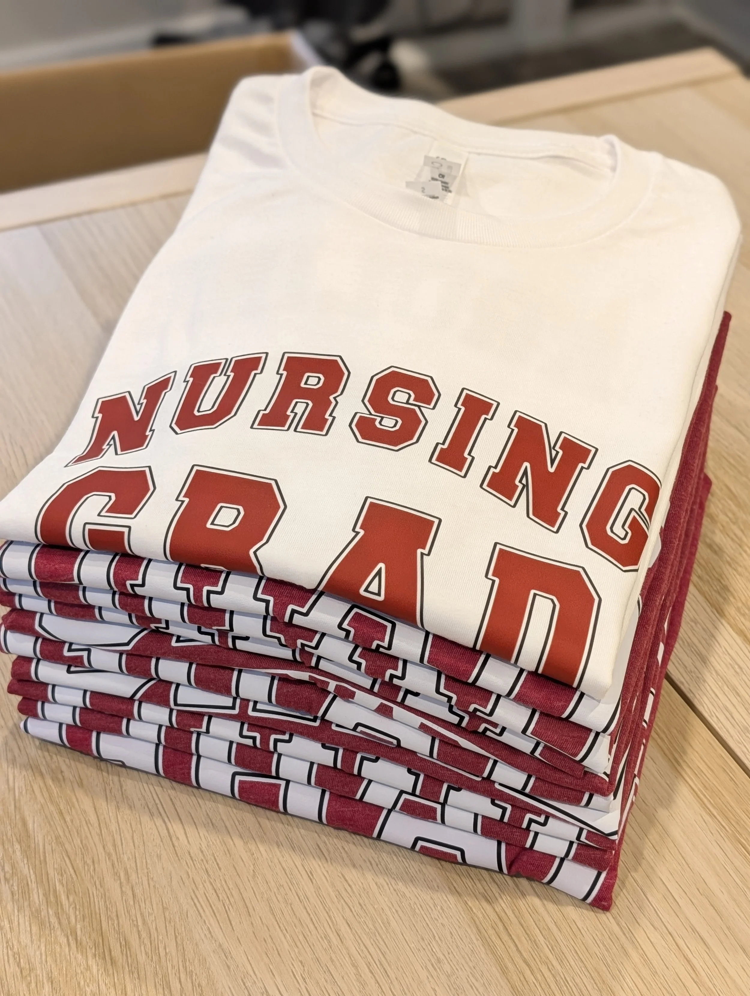 This was a fun project. A nursing grad got a custom grad shirt, and her family/friends got Grad Squad shirts to support her. 