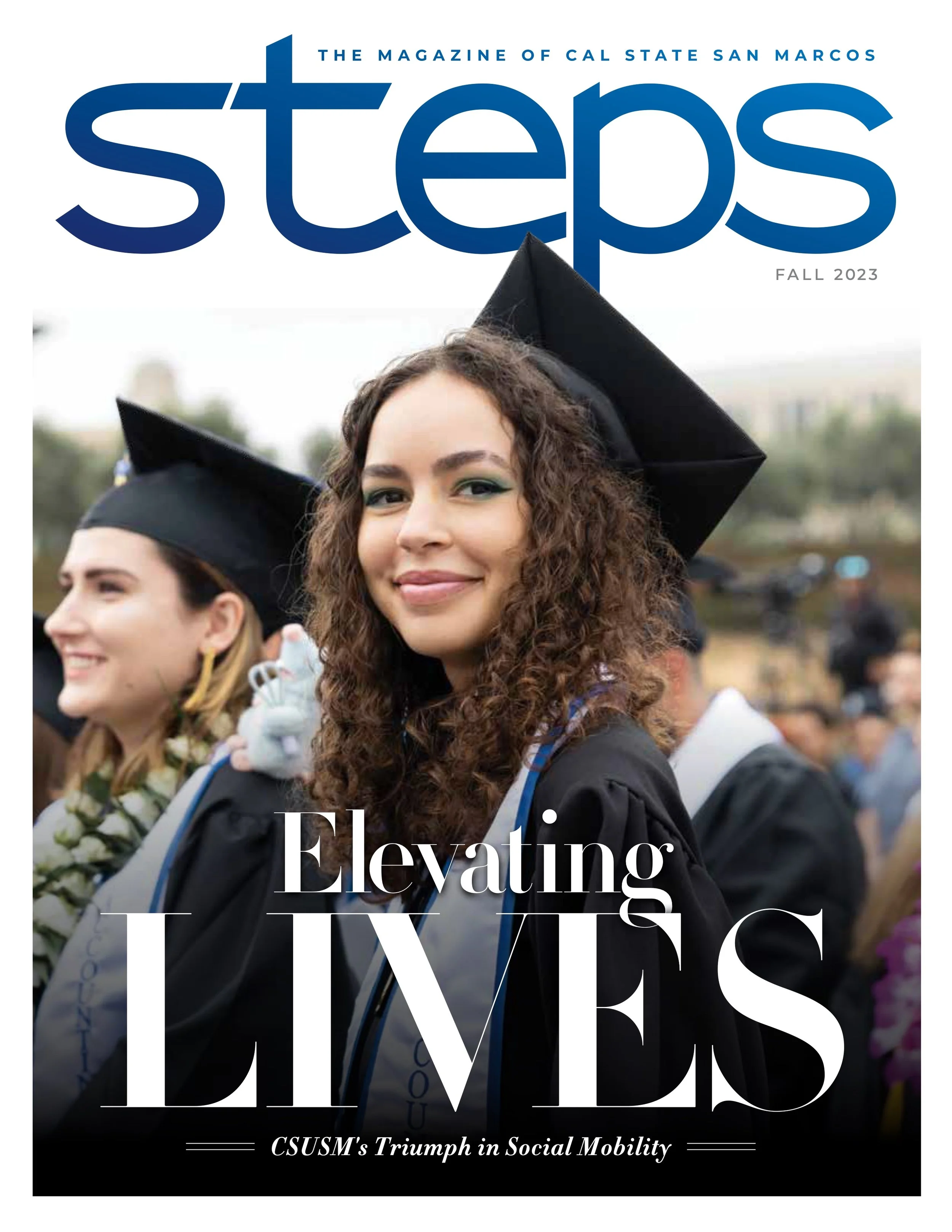 Cover of a magazine titled "Steps" showing a young woman in a graduation cap and gown, smiling. The magazine is called "The Magazine of Cal State San Marcos," and this is the fall 2023 issue. The headline reads "Elevating The Ivory" and the subtitle 