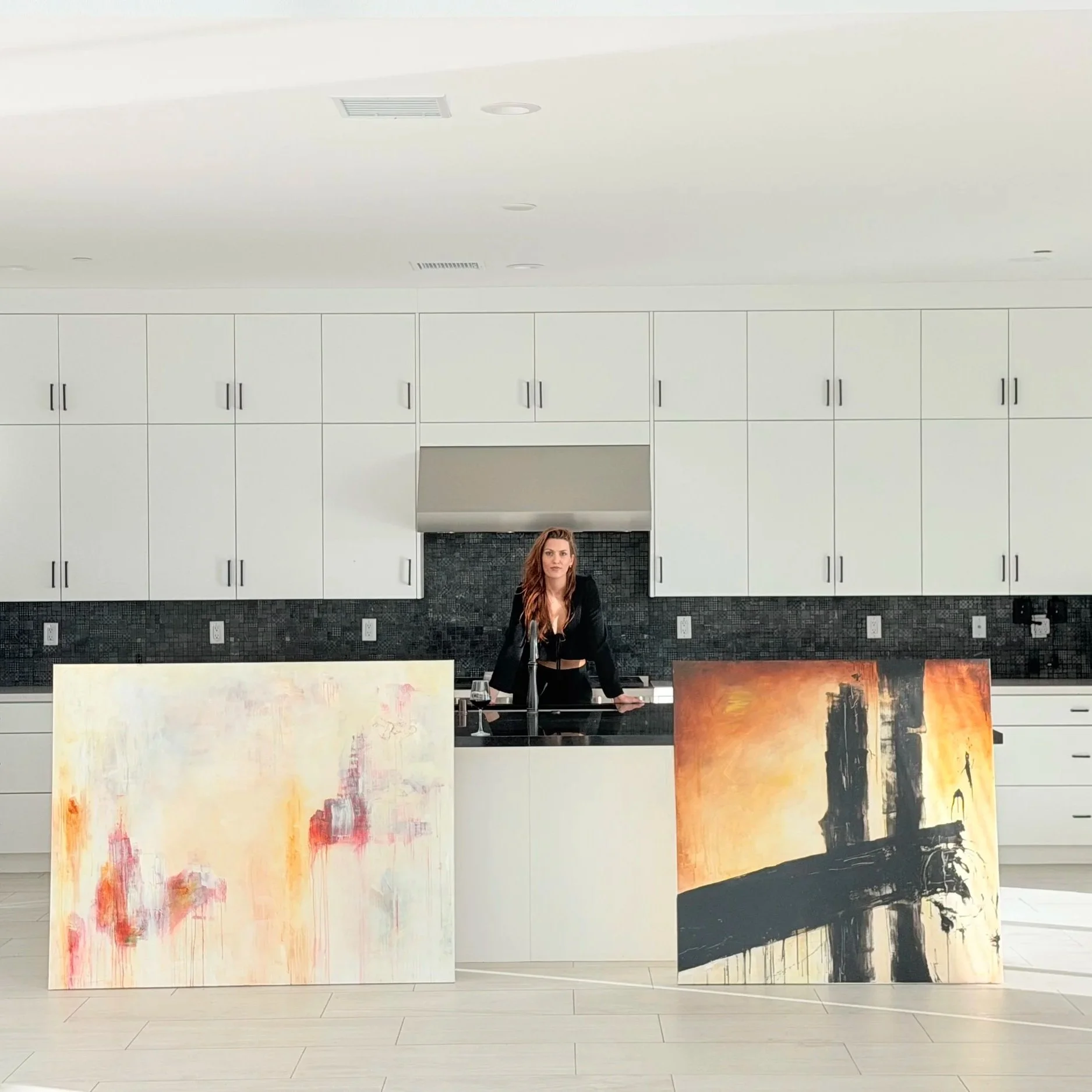 Abstract paintings by Andrijana Kuzmanovic displayed in a contemporary gallery setting.