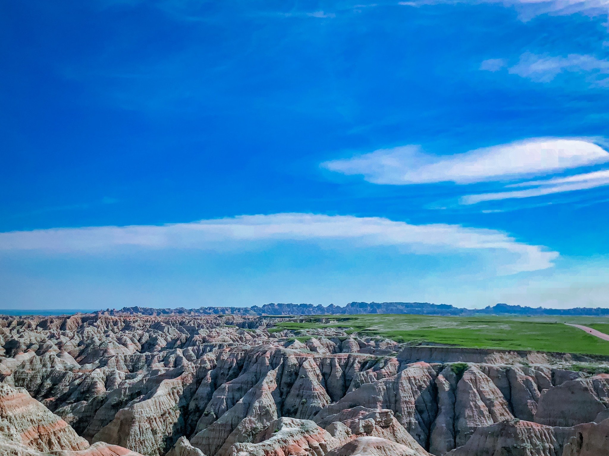 Badlands Under Blue Sky