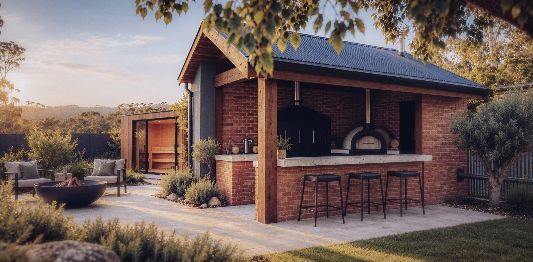 Luxury backyard outdoor kitchen with brick pizza oven, bar stools, fire pit, and landscaped patio