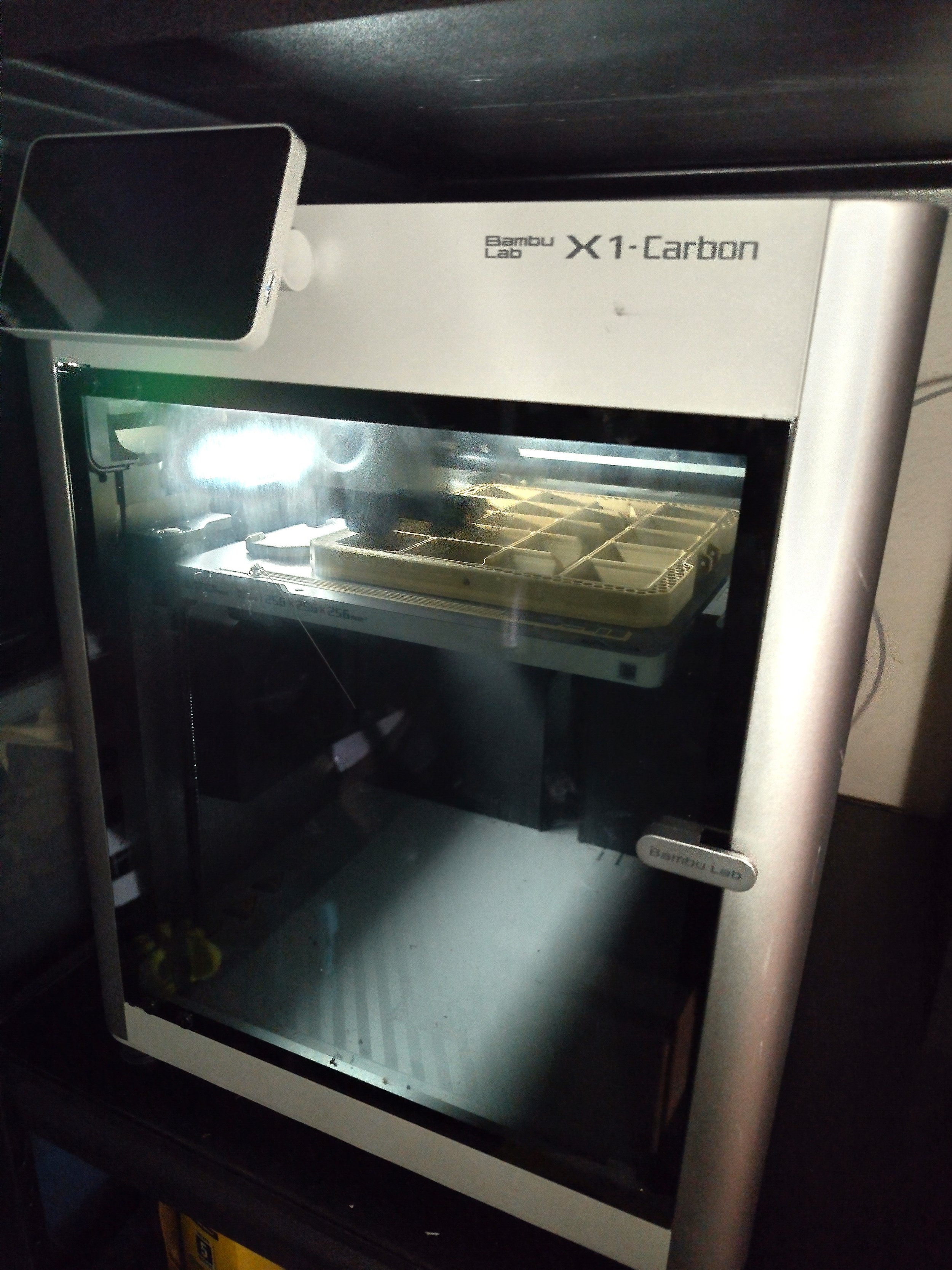 A close up picture of a Bambu Lab 3D printer.