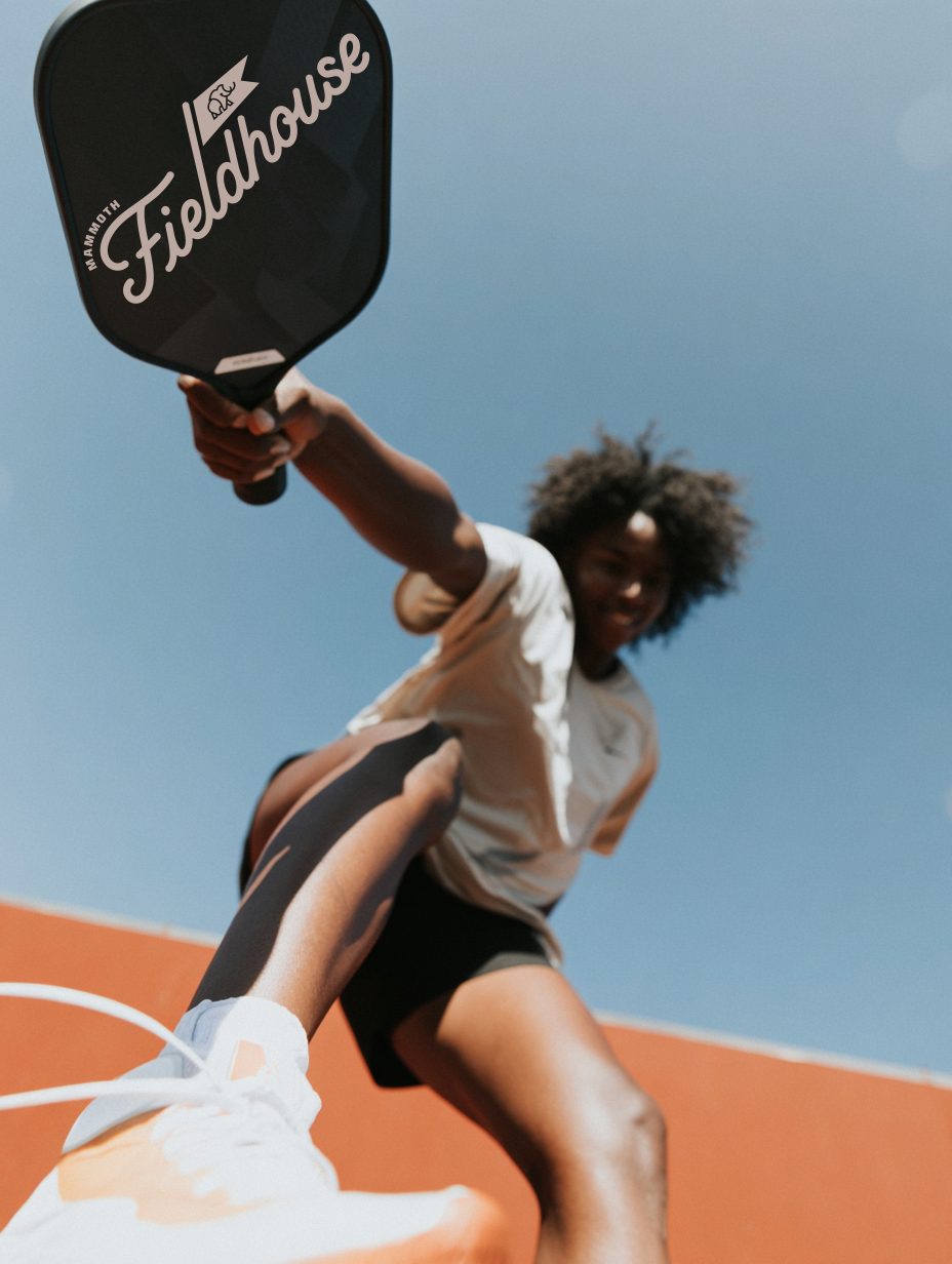 u9767649428_Cinematic_action_photo_of_a_pickleball_player_mid_4079a479-ff31-4fdb-8ffa-46606ee09710_0.png