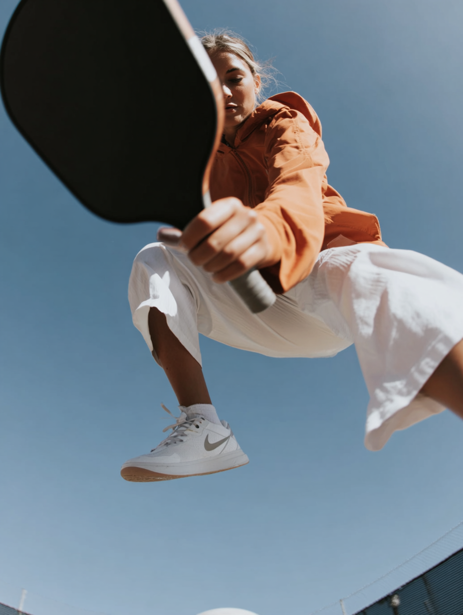 u9767649428_Cinematic_close-up_action_photo_of_a_pickleball_p_c41d187b-5a7c-41fa-bc36-3091e0c26089_2.png