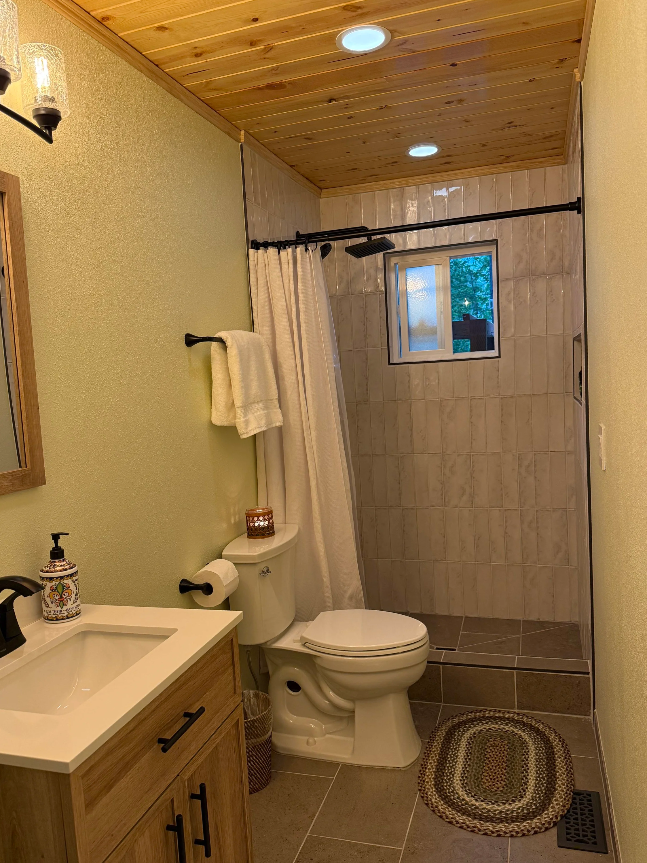 Bathroom addition; tile, window installation, plumbing, electrical, custom lighting, drywall installation, texturing, heating, painting, hardware install, Cando General Contracting, Andrew France Owner & Operator
