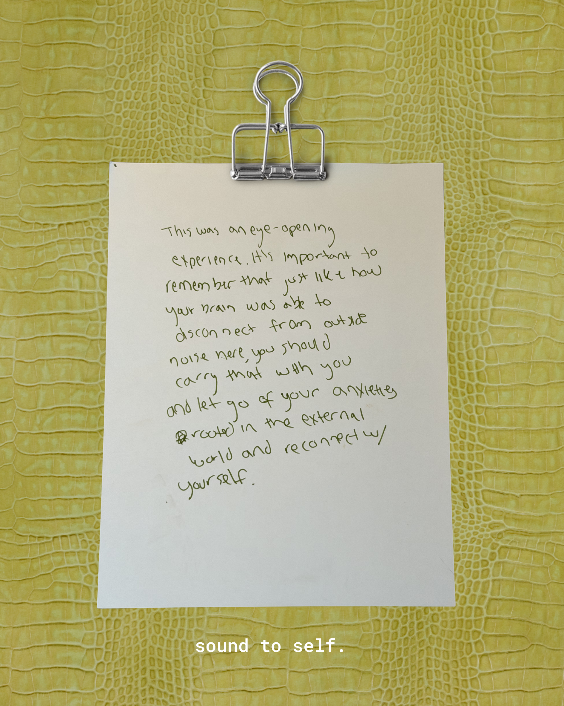 A handwritten note on a white piece of paper clipped onto a yellow textured surface with a crocodile or alligator skin pattern. The note discusses the importance of sound for self-awareness and mentions the ability of the brain to disconnect from external noise to focus on internal sounds.
