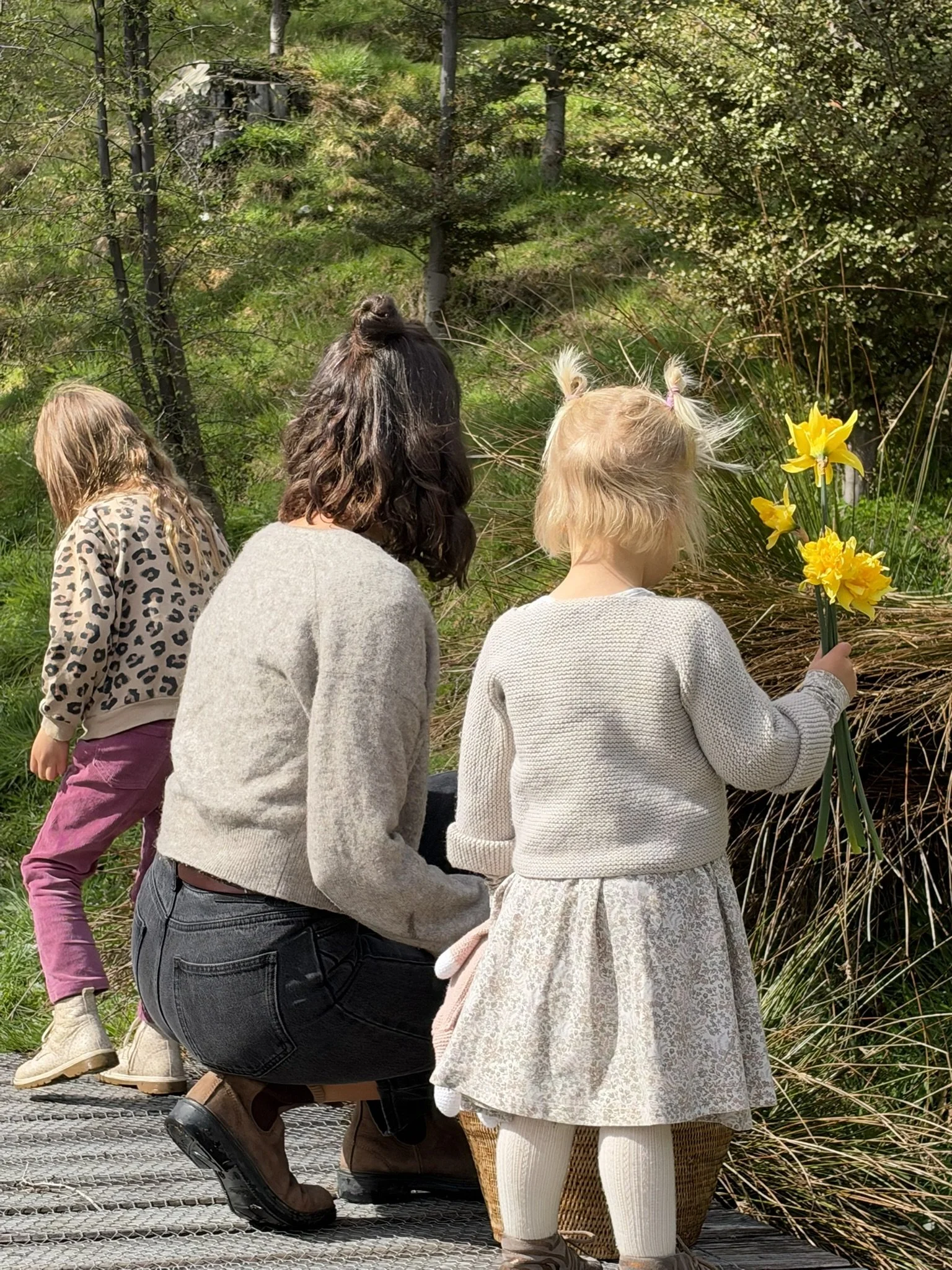 Georgie and her daughter out in the garden picking flowers together.