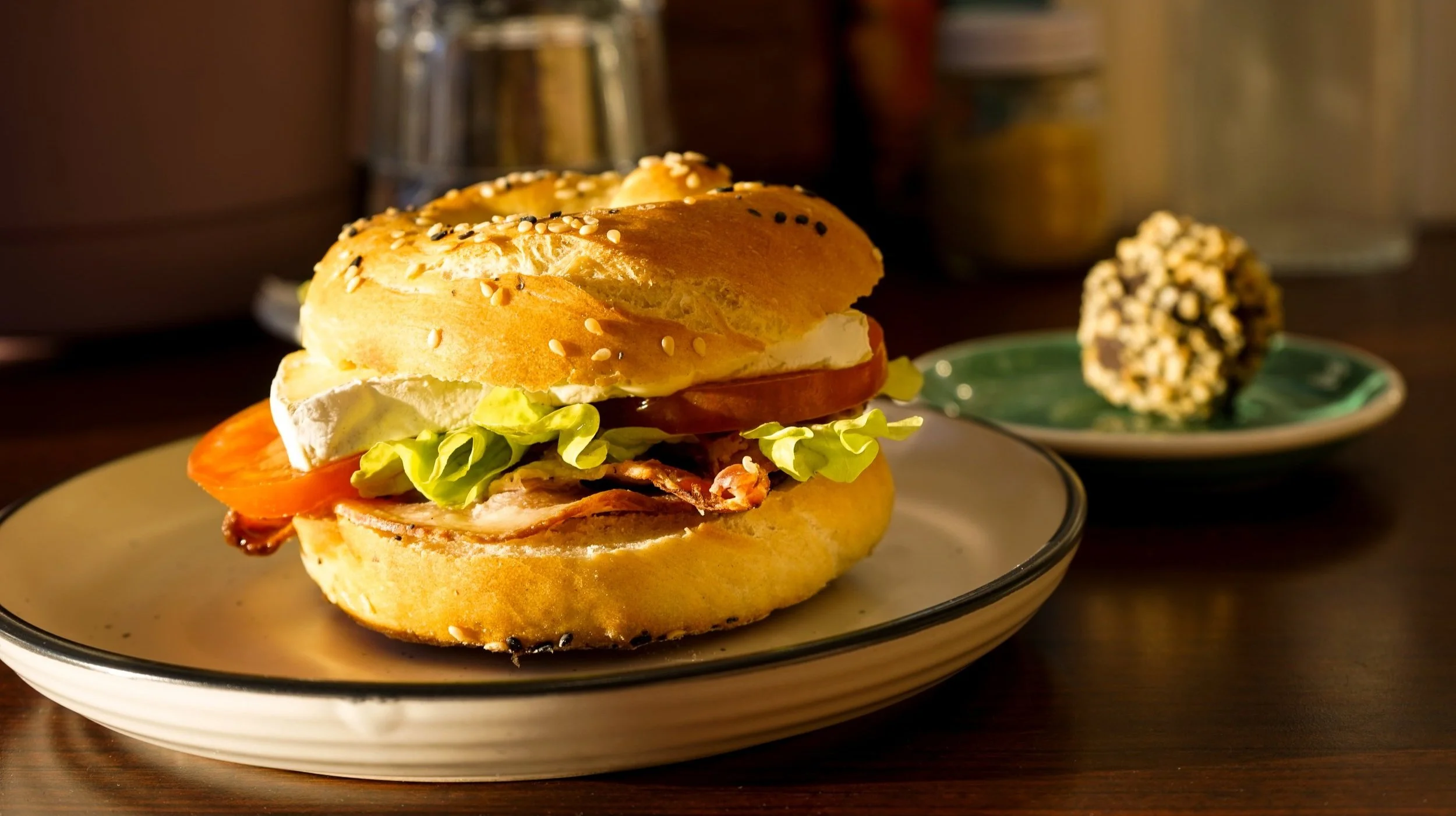 Little Brewer turkish sandwich called the Italian Job featuring delicious salami, spinach, tomato and red pesto alongside a house made chocolate bliss ball.