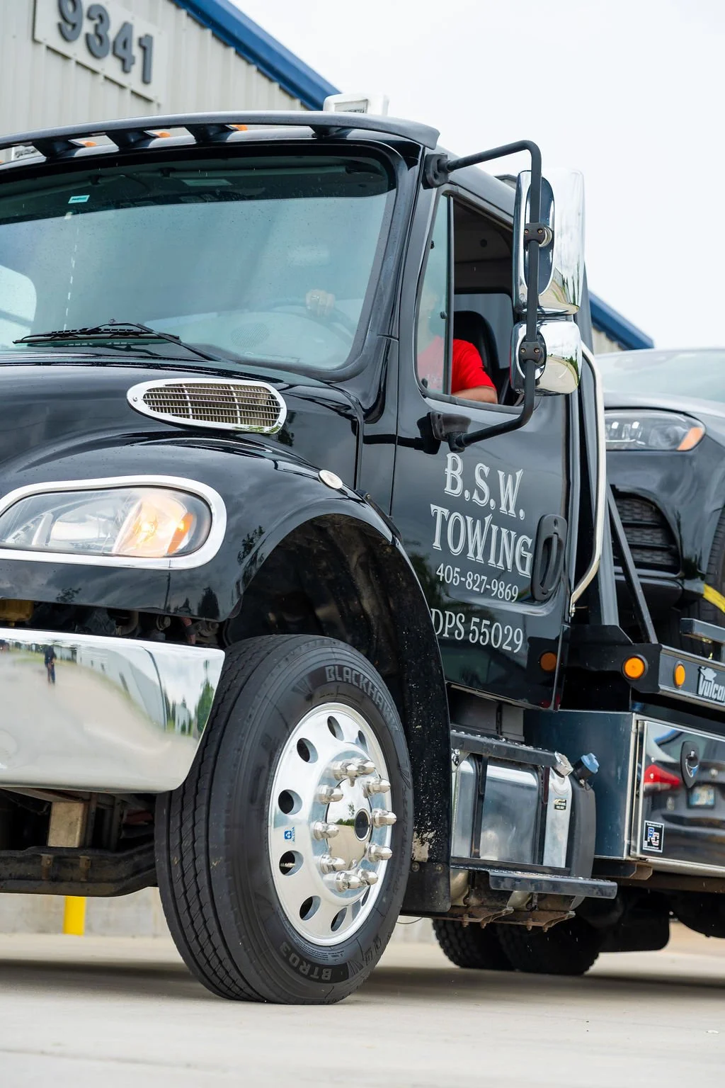 A black tow truck with