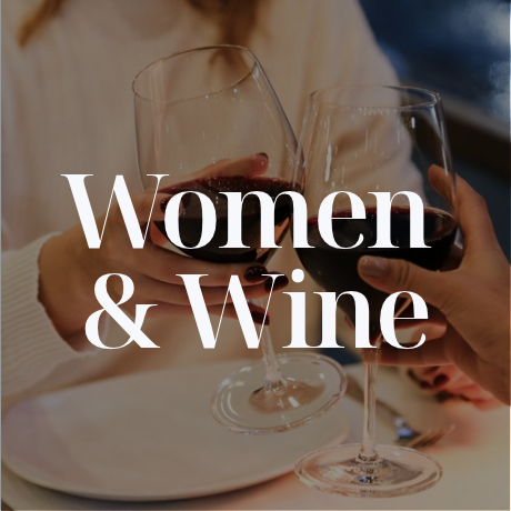 Women cheers with red wine 