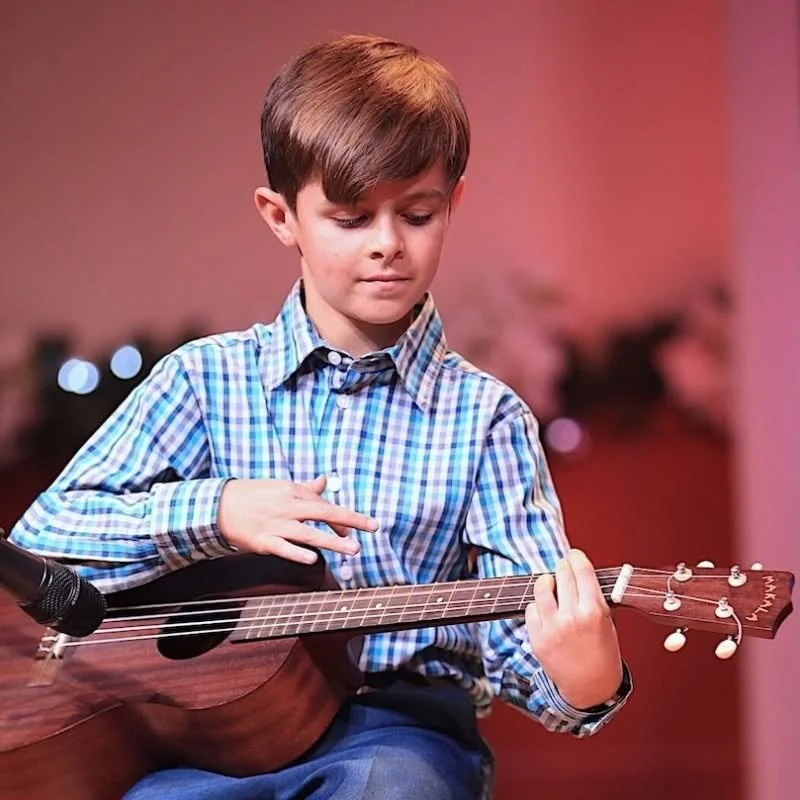 Student performing on the ukulele