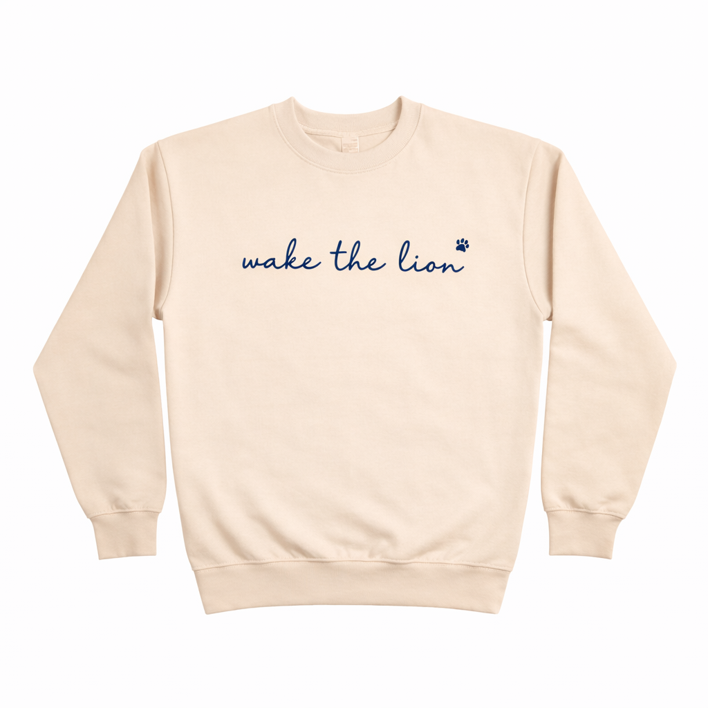 Wake the lion sweatshirt flat lay.png