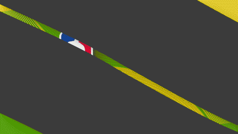 Close-up of a black and yellow race track with a blue, white, and red flag marking the edge.