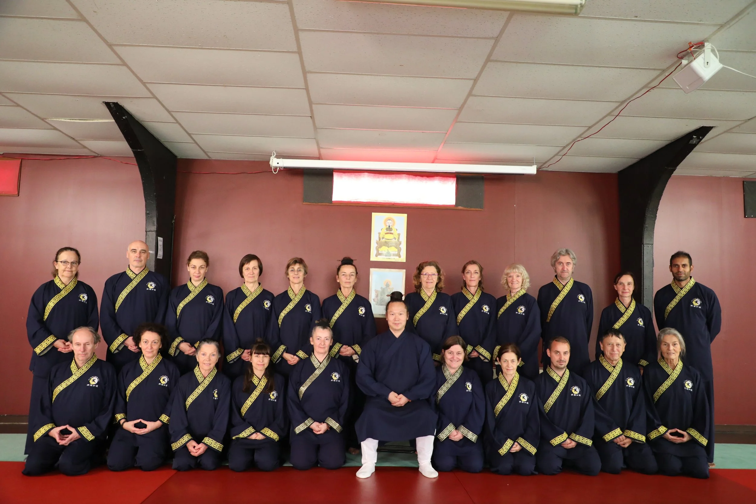 Group photo of the international Wudang Gong Dao instructor training class kneeling in formation