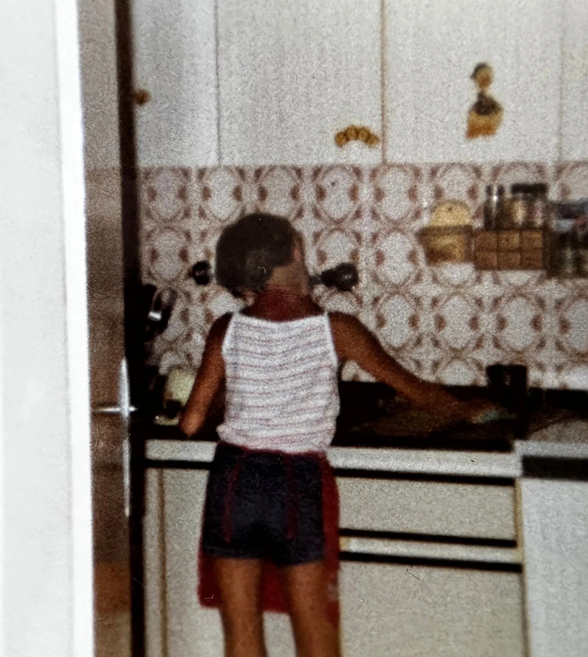 Diana as a child tidying the kitchen at home in Podčetrtek, Slovenia