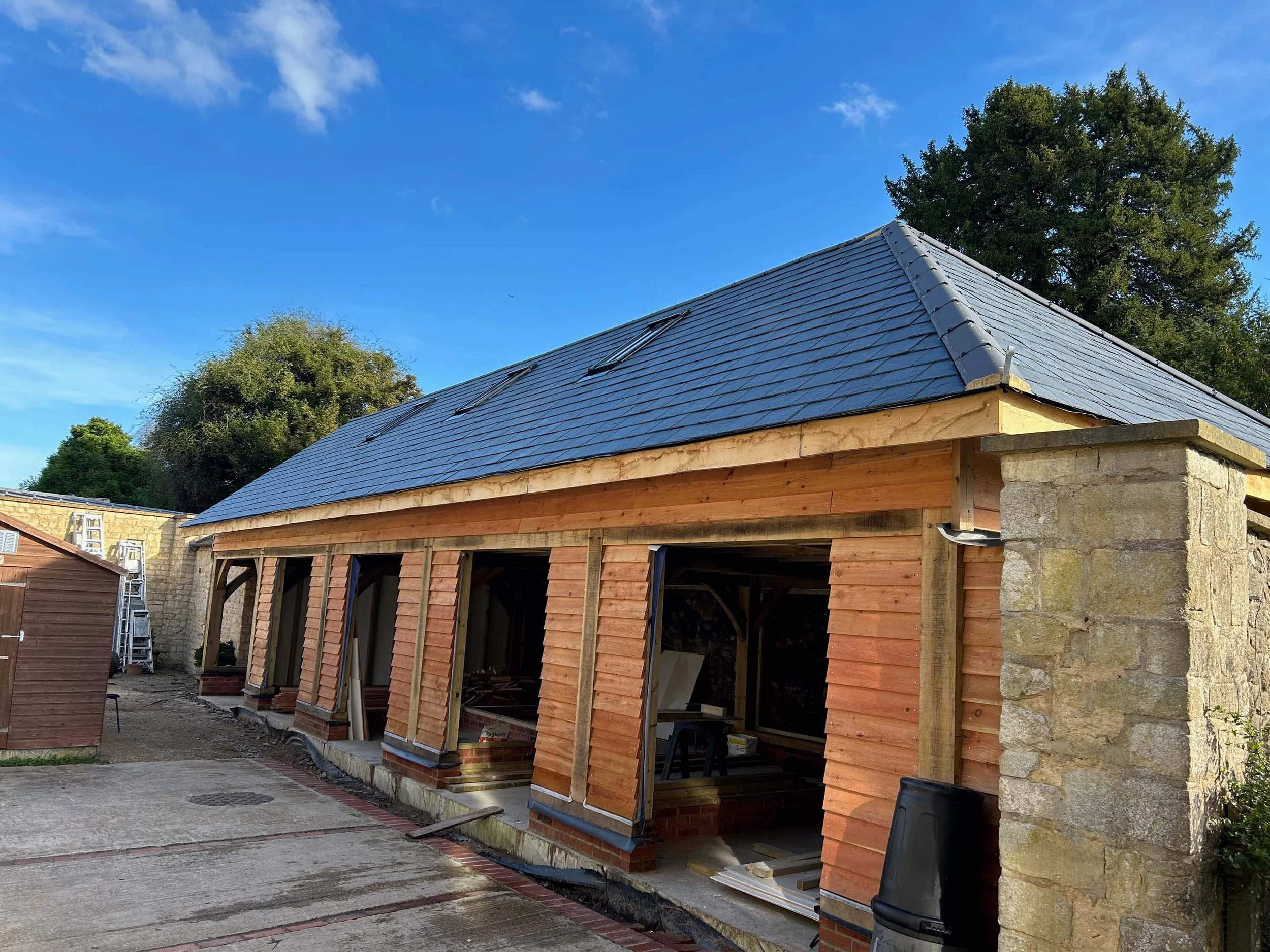 An image of a 5 bay oak barn in Waterperry Gardens.