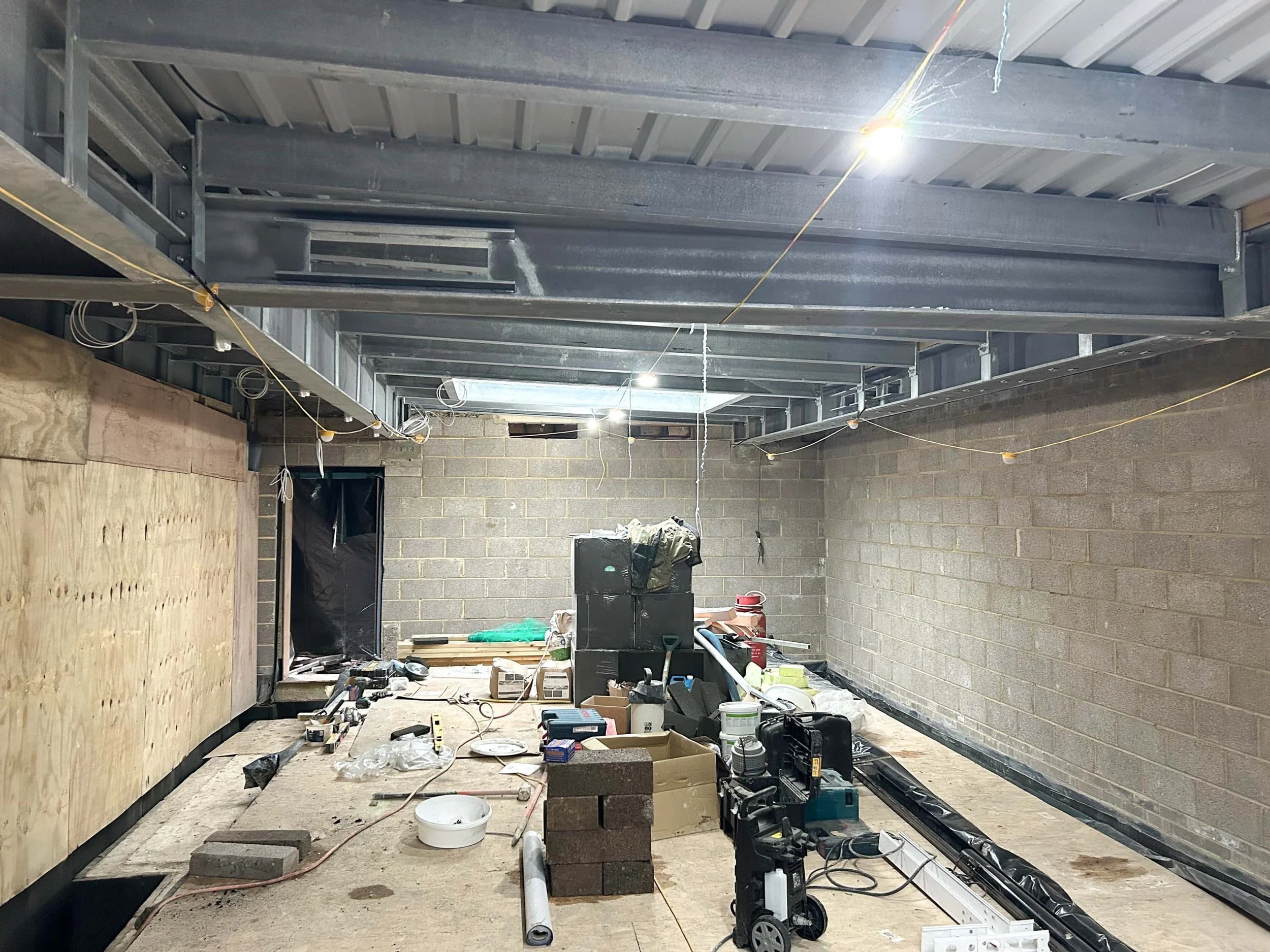 An image of the unfinished swimming pool room. 