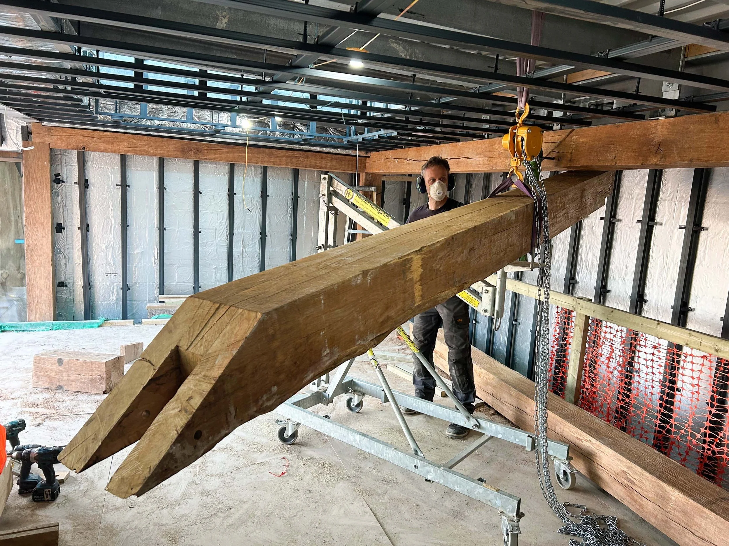 An image of a winch lifting an oak beam