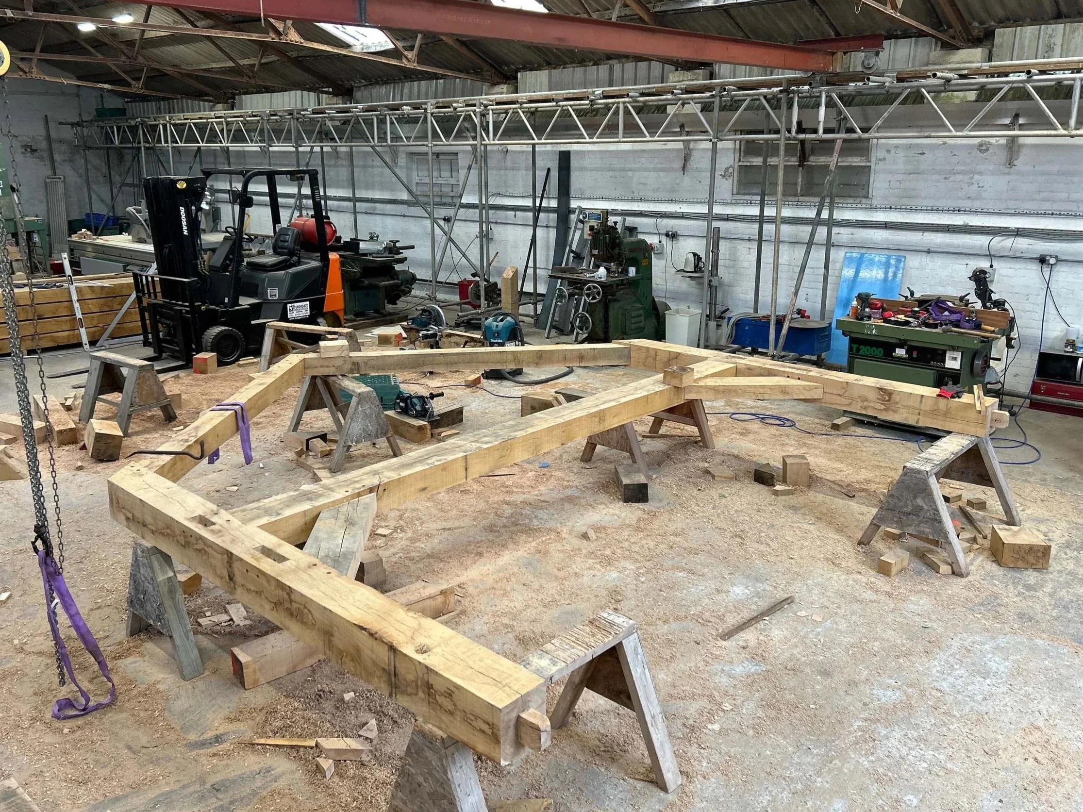 An image of assembling oak beams for Chinnor sculpture in a workshop in OXfordshire