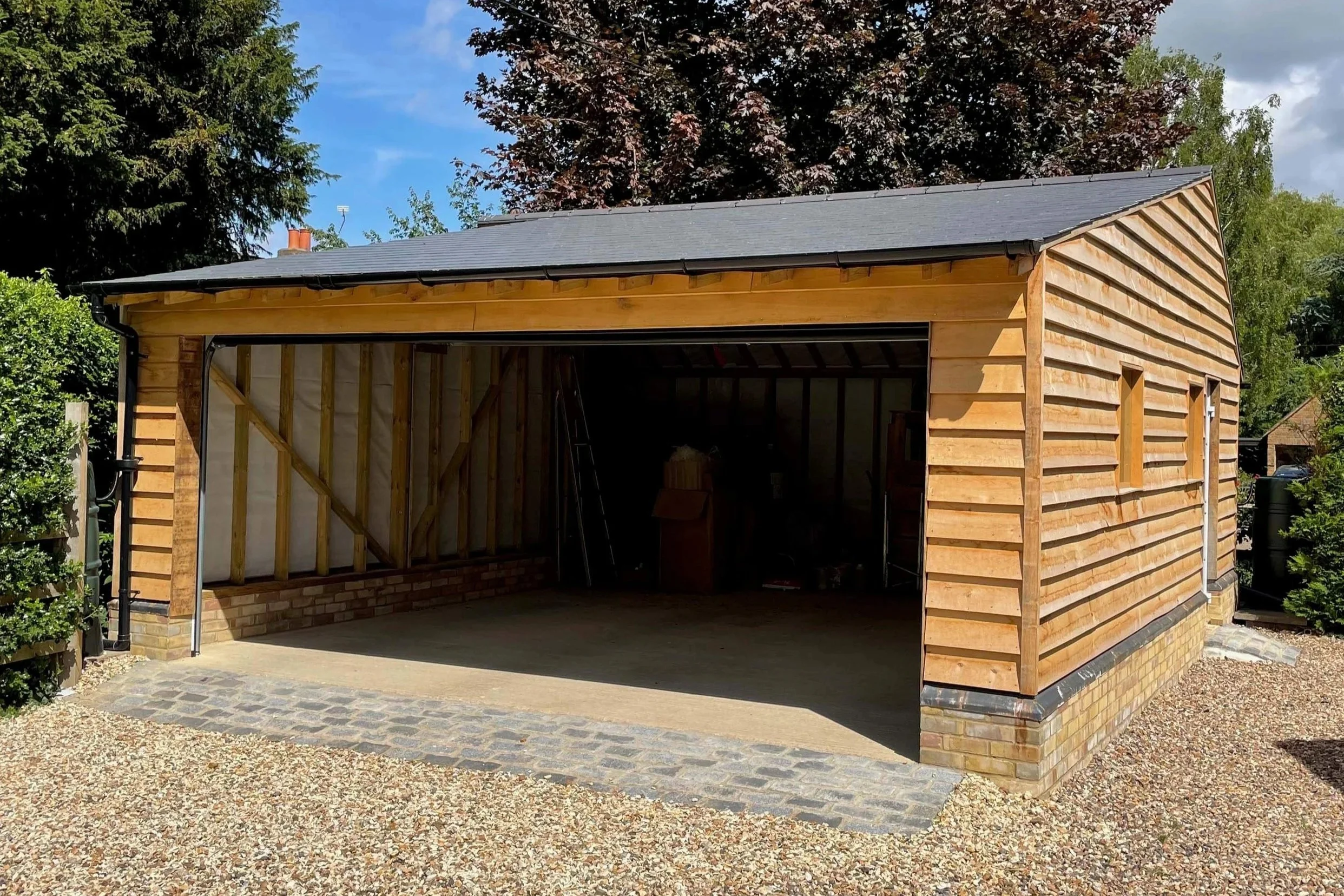 An image of a timber frame car garage