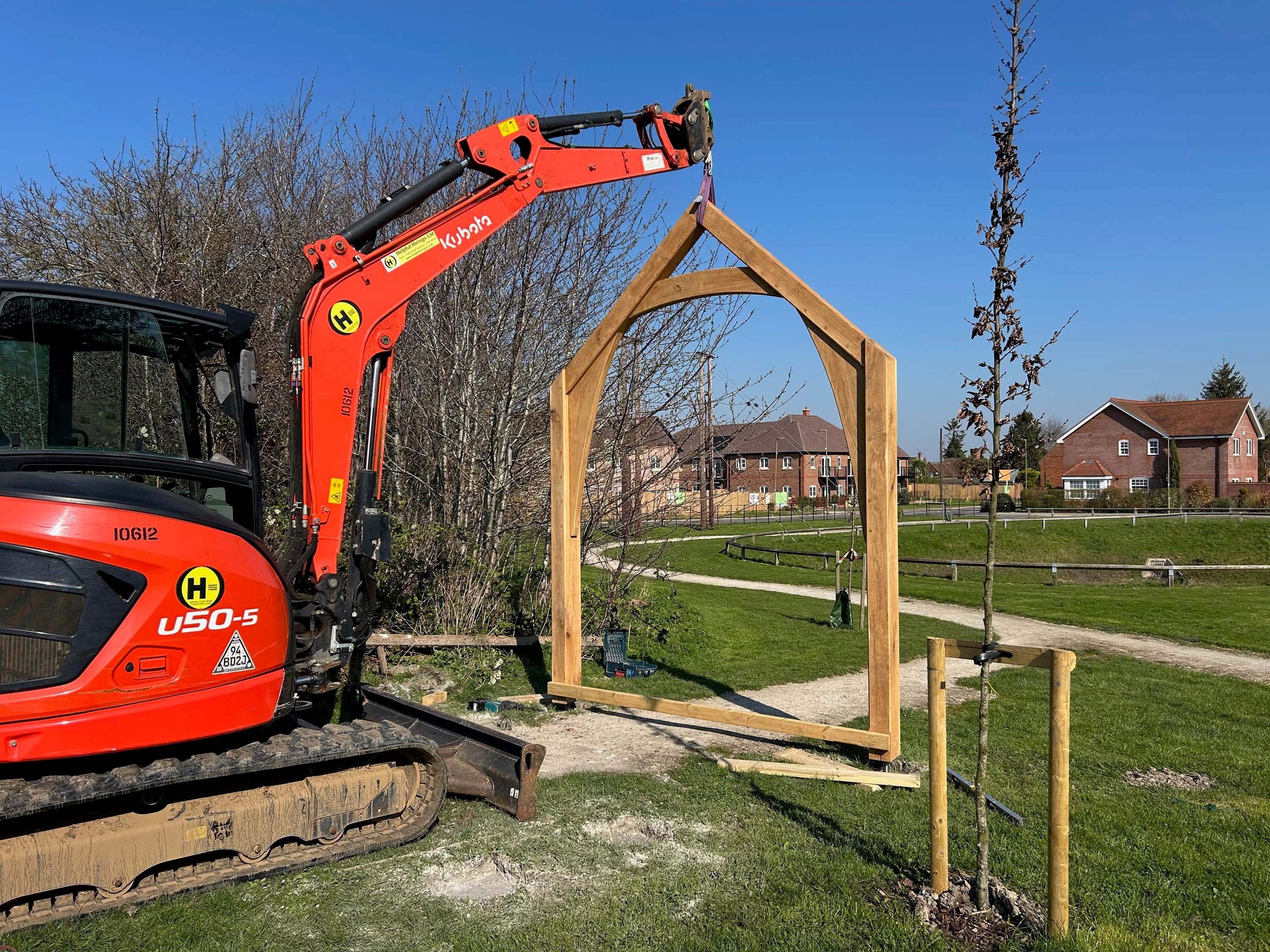 An image of a crane erecting an oak frame sculpture in Chinnor 