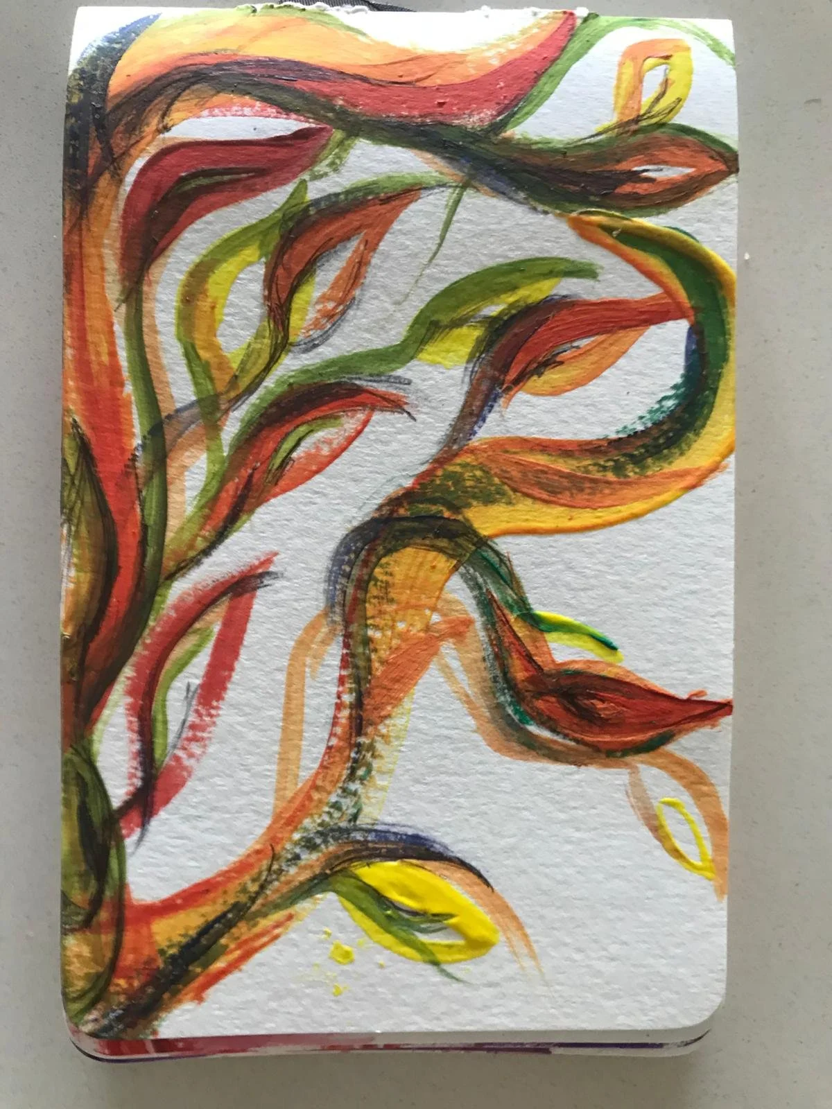 Abstract watercolor painting with swirling lines and shapes in red, orange, yellow, green, and black on textured paper.