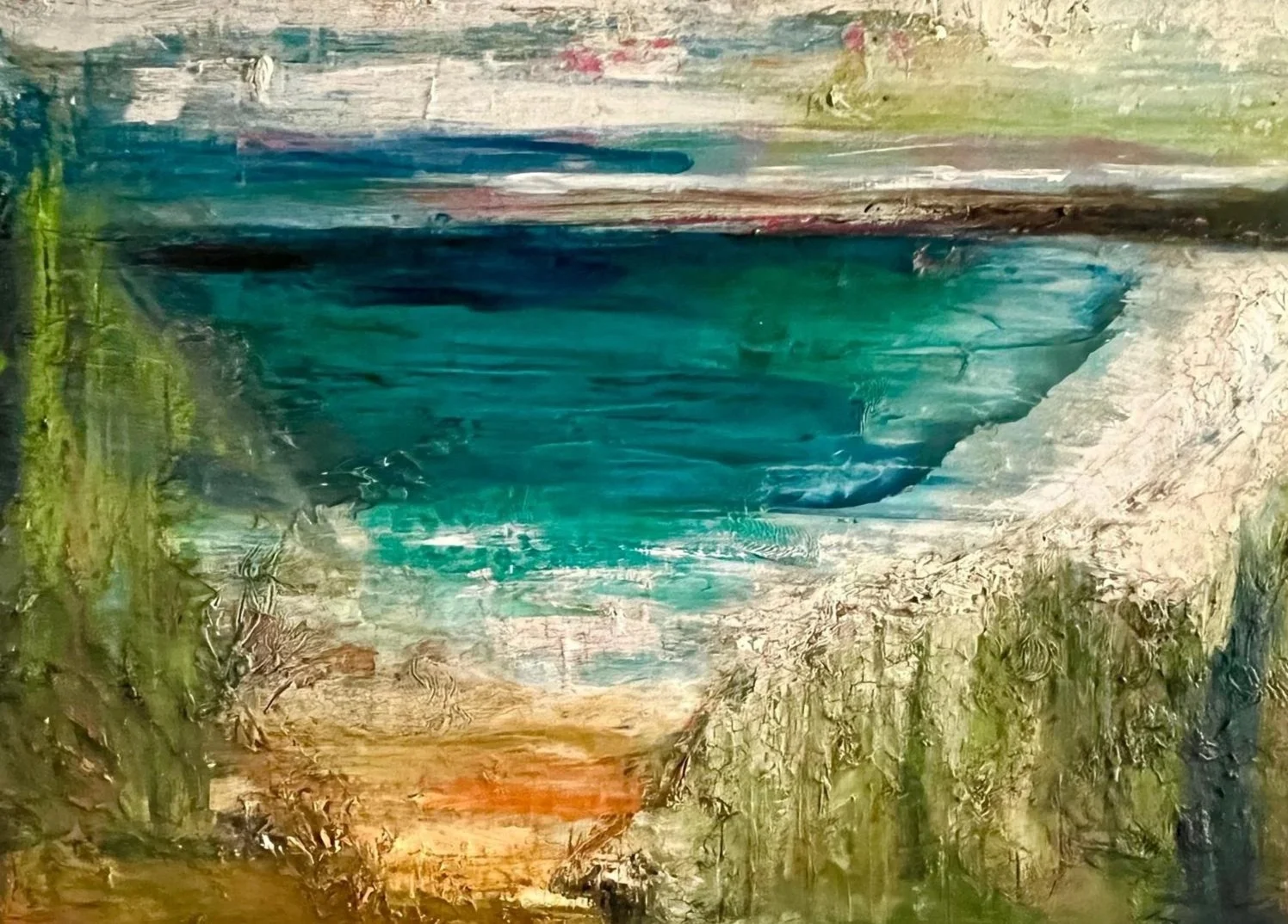An abstract landscape painting featuring a large blue-green body of water surrounded by greenery, with a light sky and hints of red and orange near the horizon.