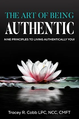 Self-development book cover for “The Art of Being Authentic” by Tracey R. Cobb, featuring a serene white lotus flower reflected on dark water beneath elegant typography.