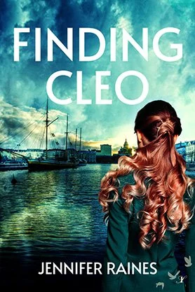 Contemporary fiction book cover for “Finding Cleo” by Jennifer Raines, featuring the back view of a red-haired woman overlooking a harbor waterfront beneath a dramatic sky.