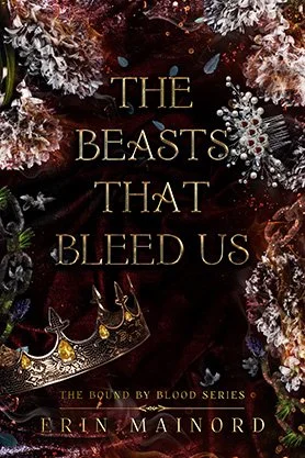 Dark fantasy book cover for “The Beasts That Bleed Us” by Erin Mainord, featuring flowers, a jeweled crown, and ornate accessories on a rich red background.