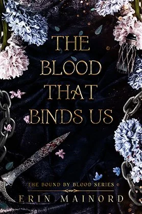 Dark fantasy book cover for “The Blood That Binds Us” by Erin Mainord, featuring flowers, chains, and a bloodstained dagger on a dark background.