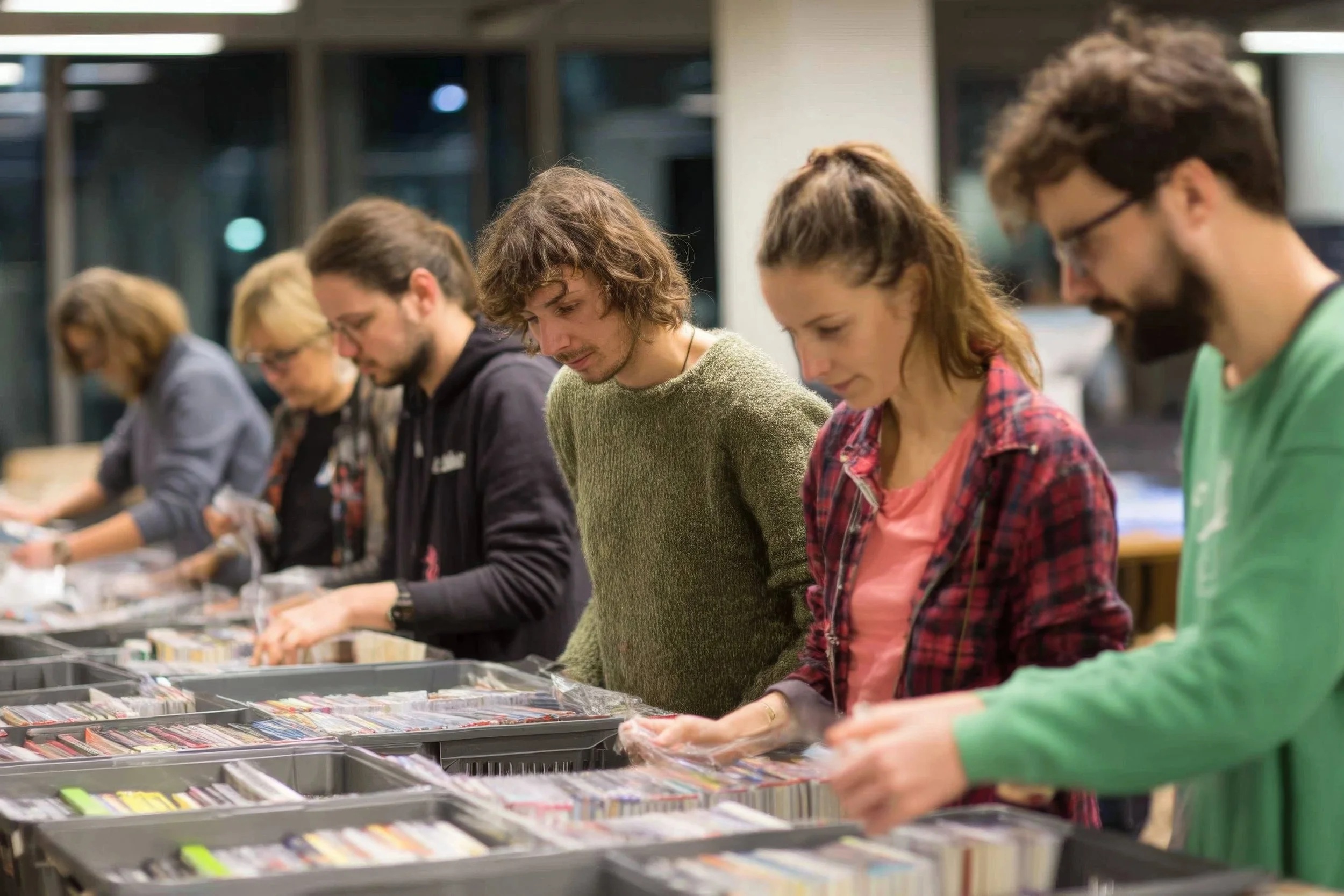 People browsing records at a record store.