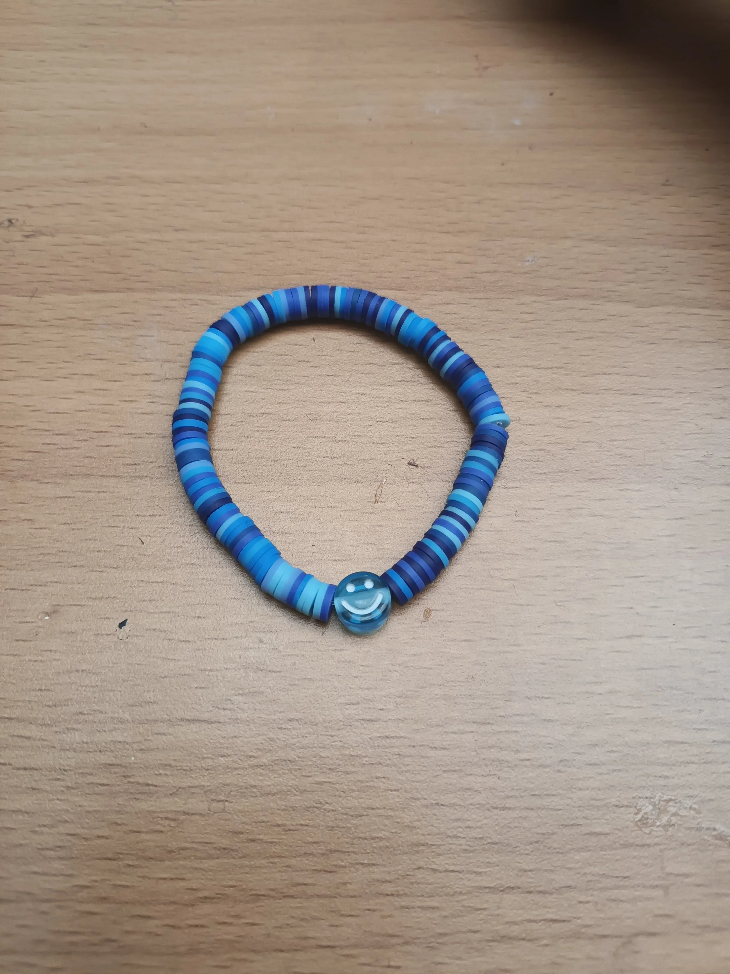 Blue smiley face bracelet