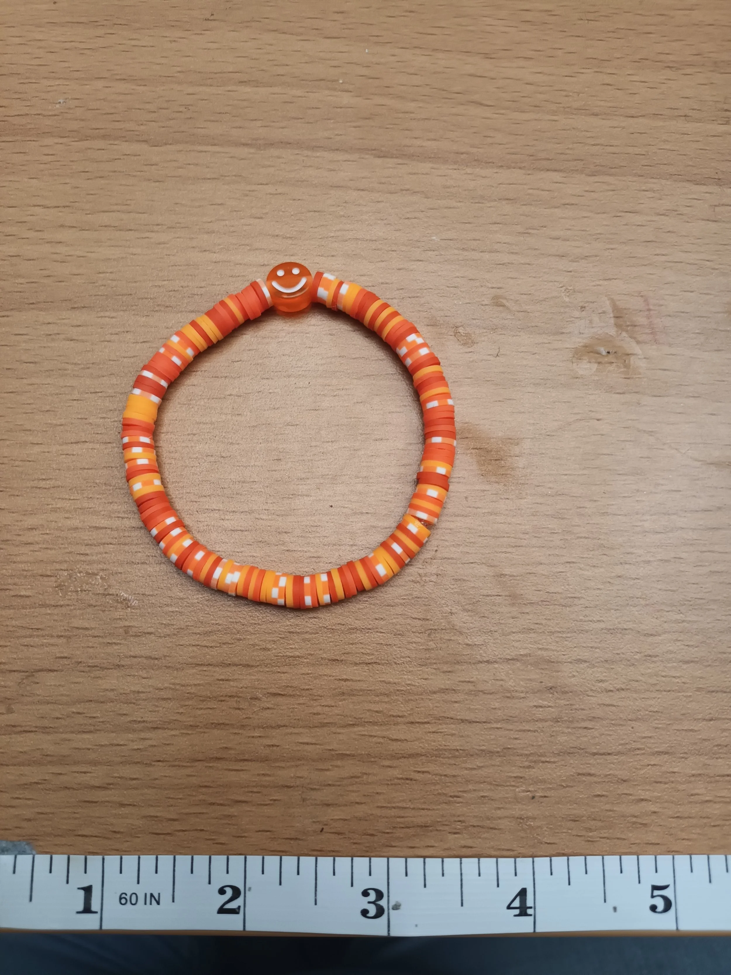 Orange smiley face bracelet
