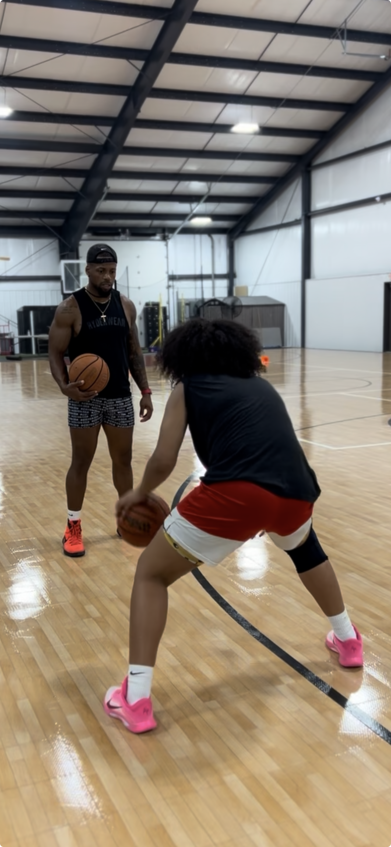 Youth basketball player practicing on an indoor court during a Gary Family Foundation program.