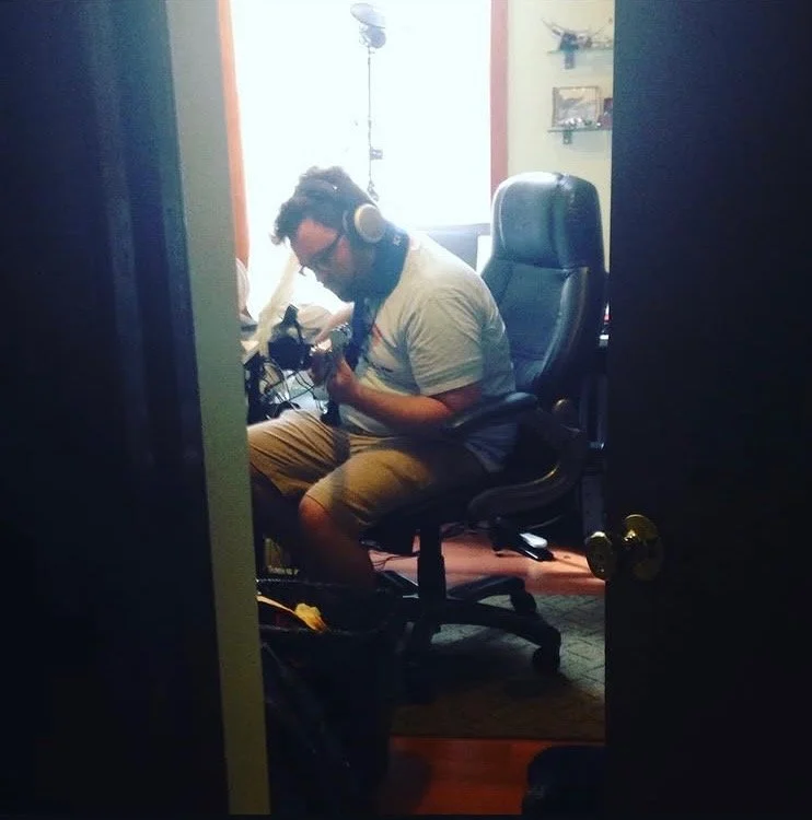 Jesse Wiener playing electric guitar in the studio