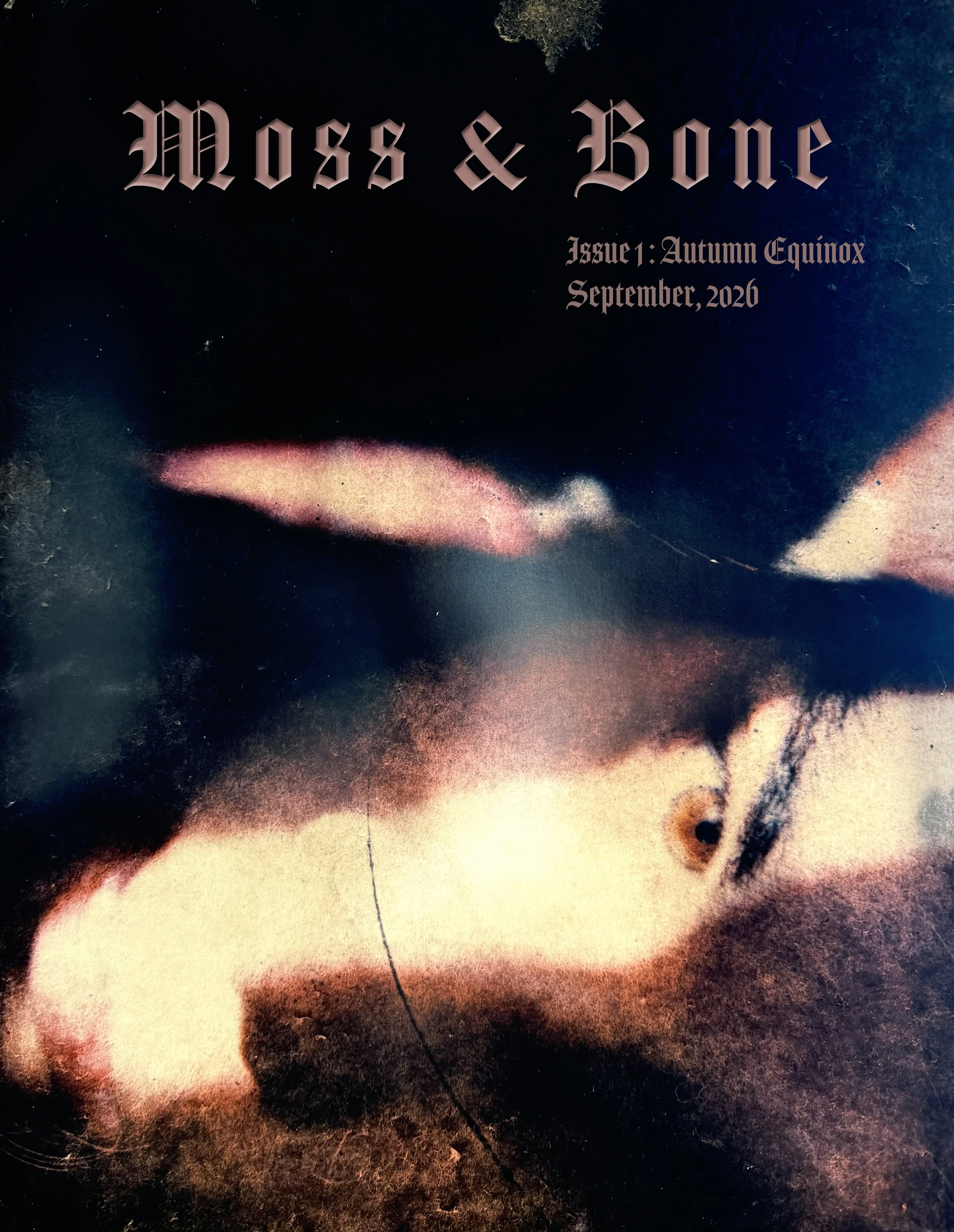 Close-up of printed magazine cover featuring a stylized human face with a smokey, cosmic background, titled 'Moss & Bone' with issue details of 'Autumn Equinox September 2020'.