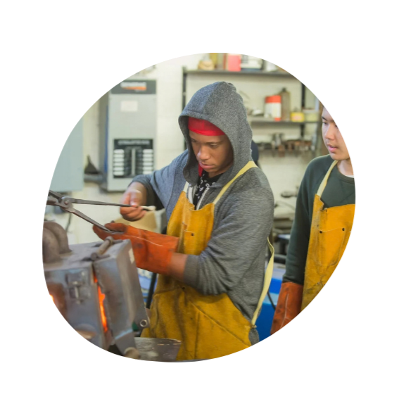 Two high school boys at Otto Specht School working on a project in woodworking class.
