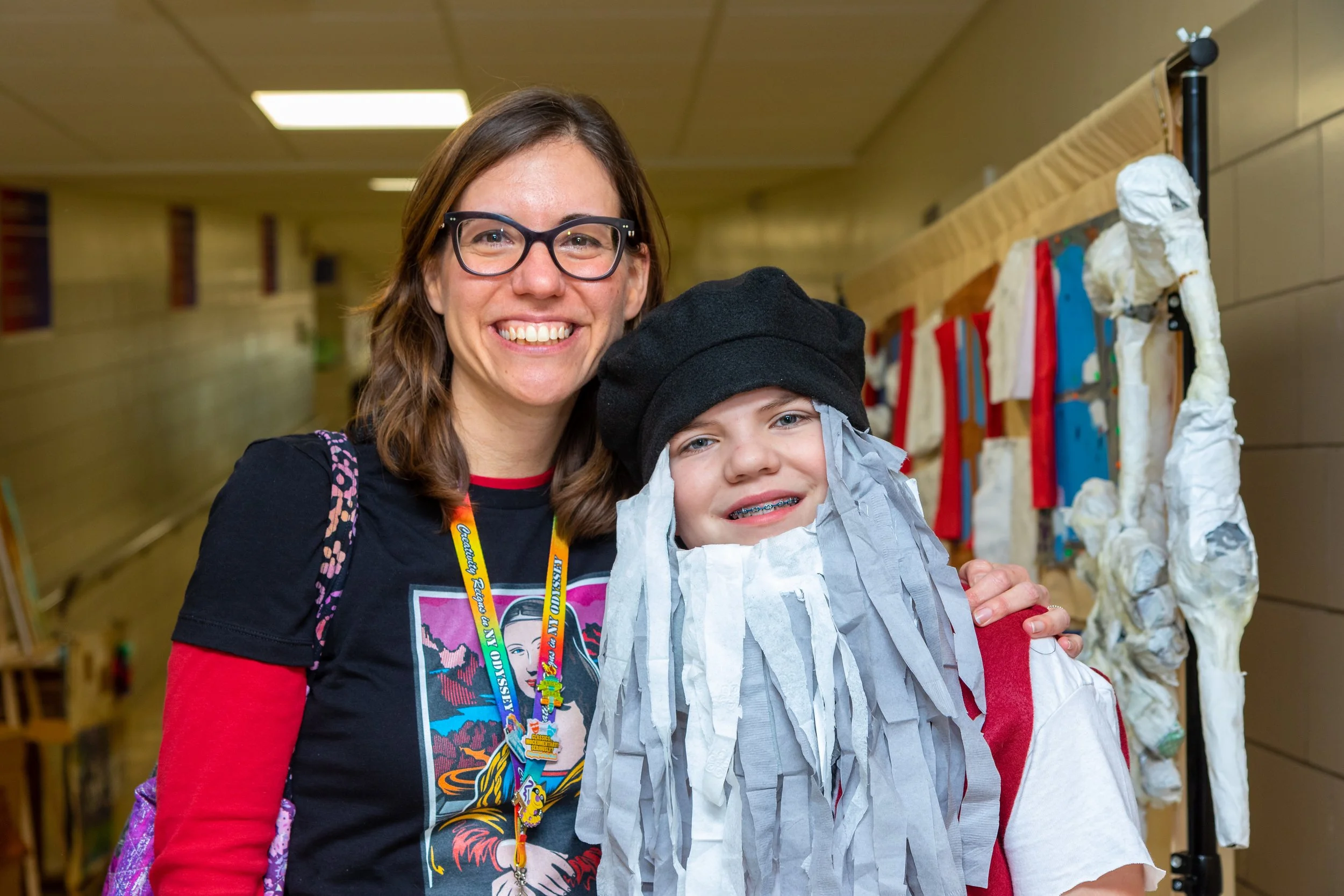 Coach with kid in costume.