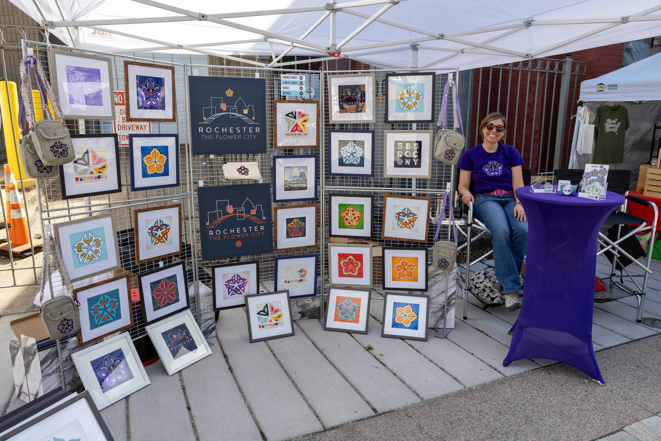 Artist booth celebrating Rochester-themed artwork.