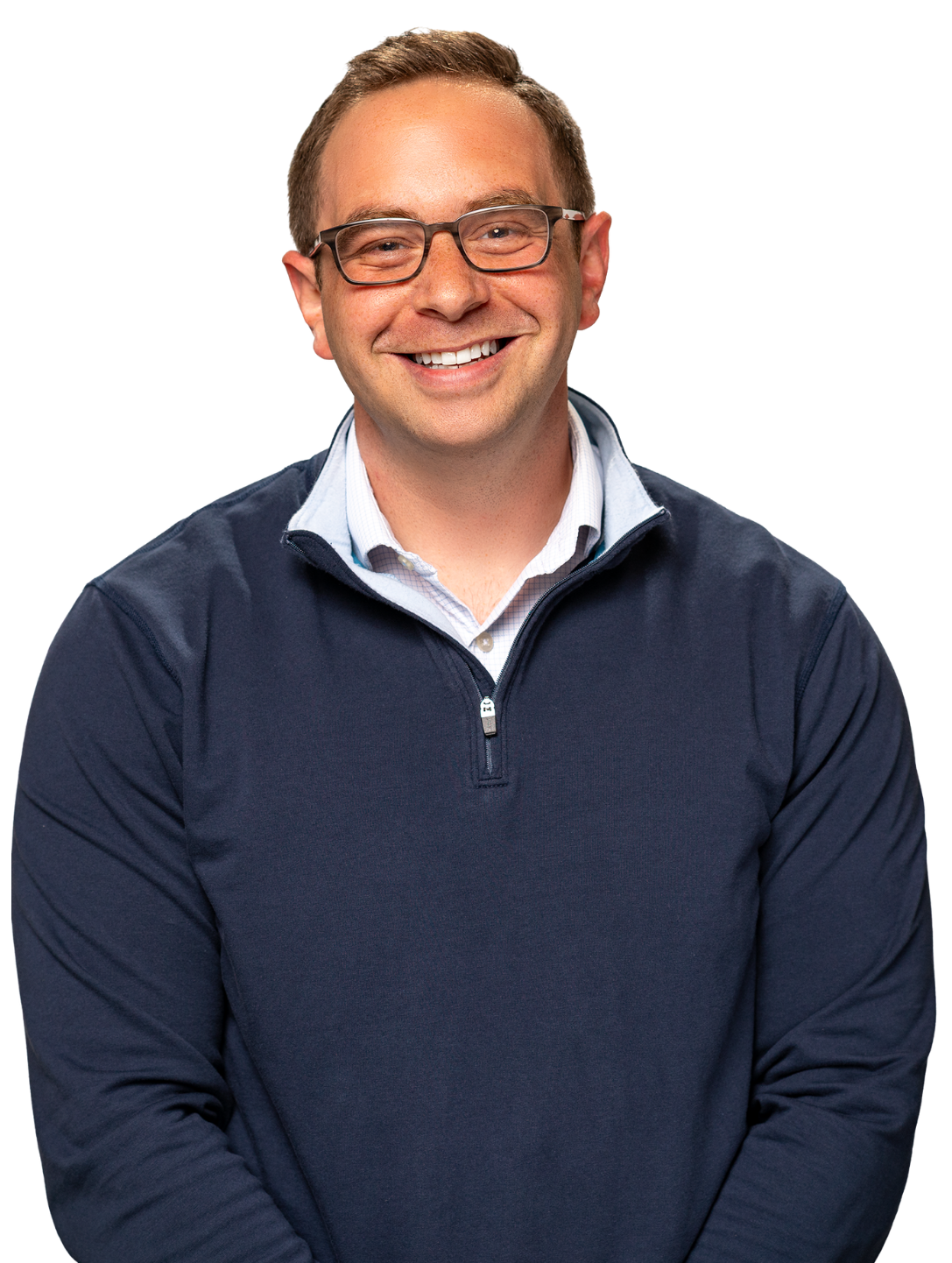 Austin Pollack wearing glasses and a navy blue quarter-zip sweater over a collared shirt.