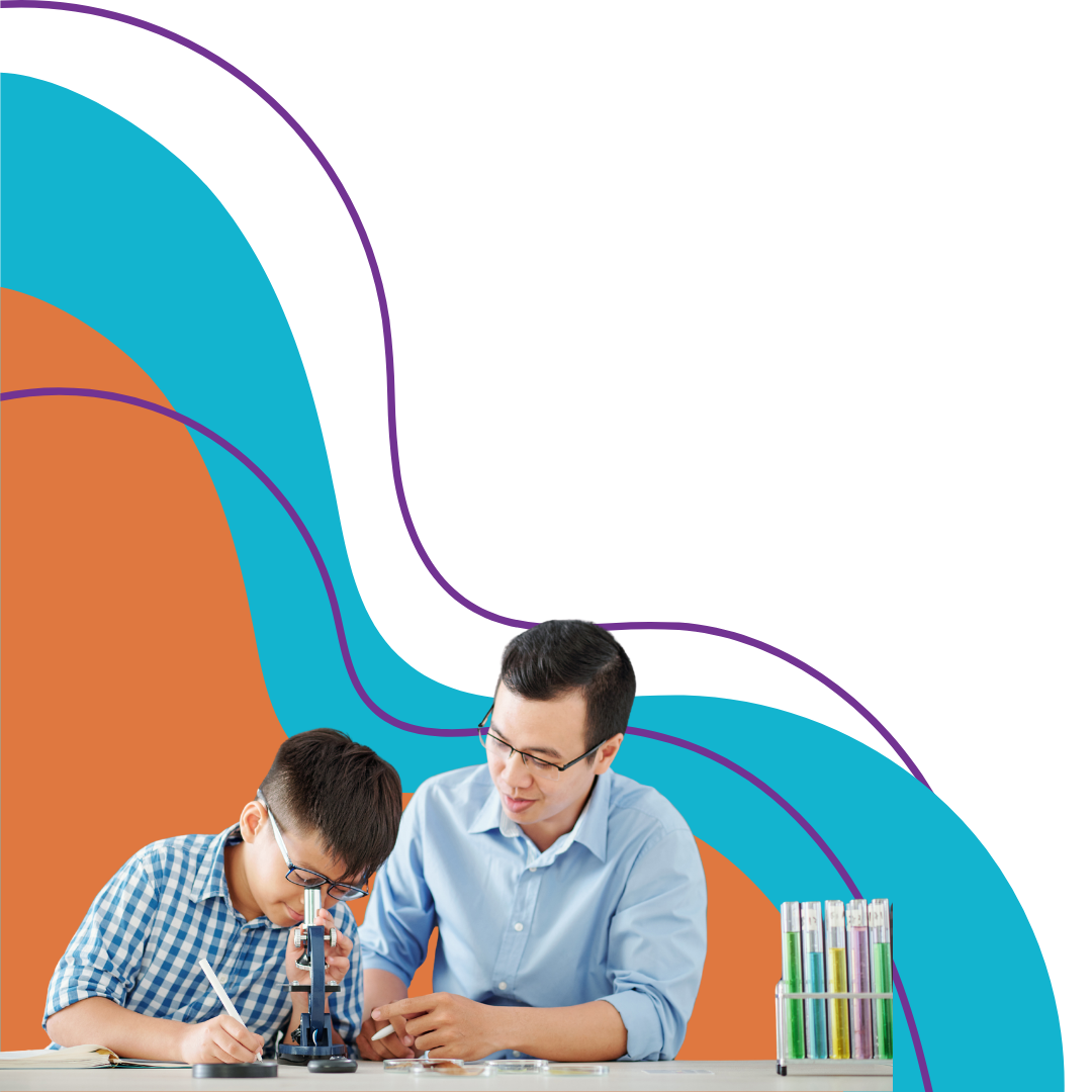 A teacher showing a young student how to look through a microscope during a science lesson, with test tubes on the table.