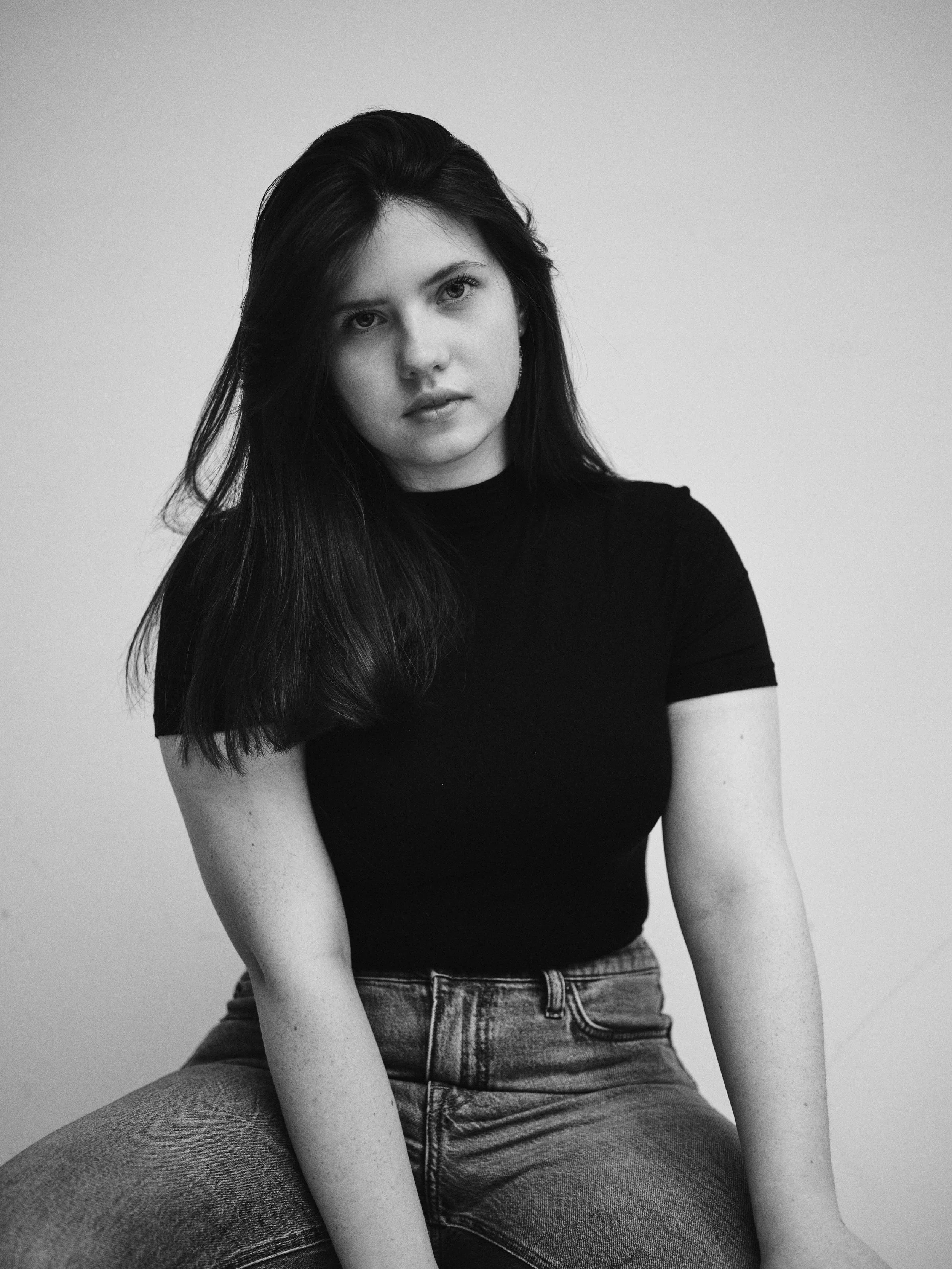 A black-and-white photo of Sarah Michael, an up-and-coming musician, with dark brunette hair