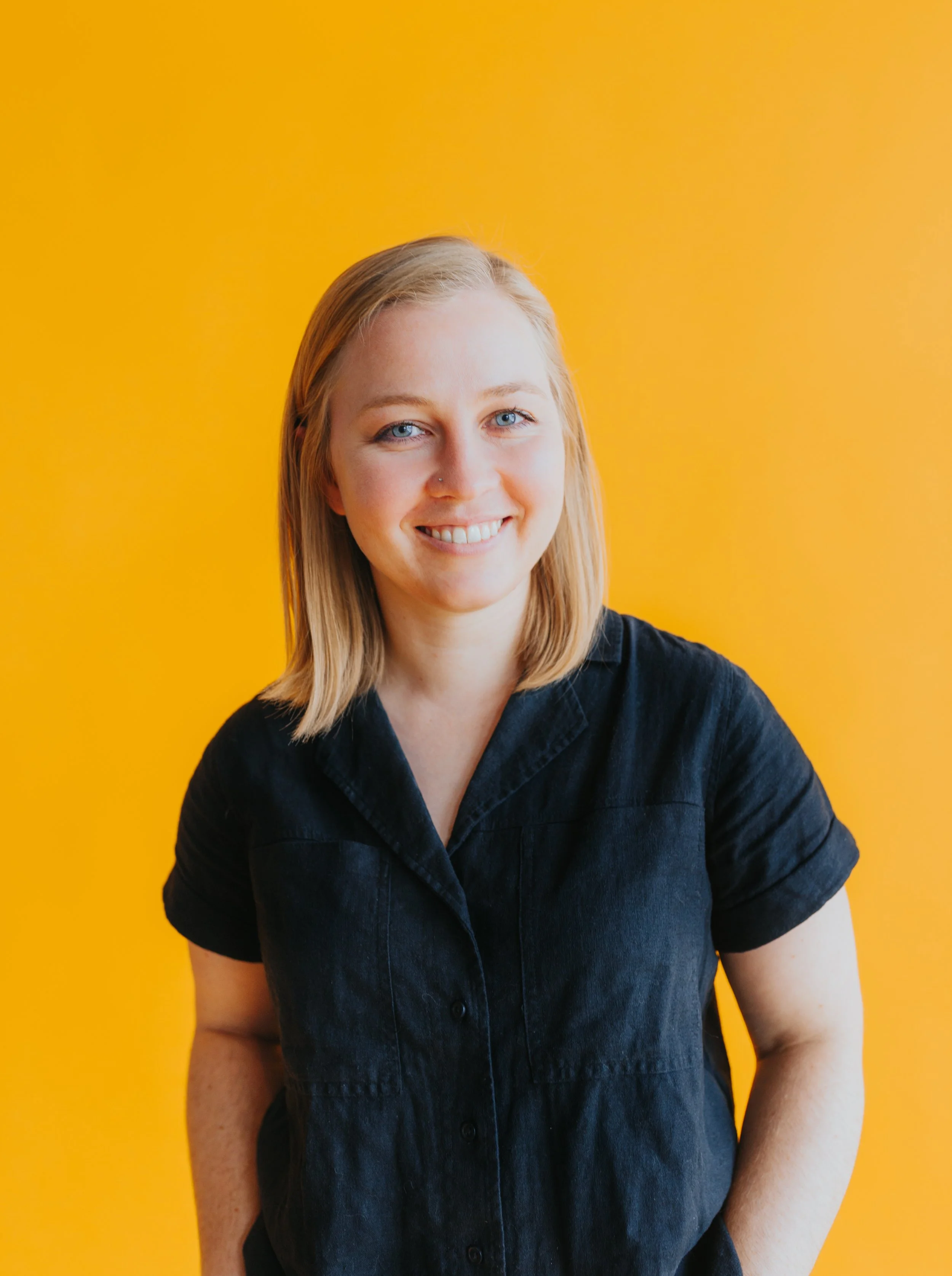 photo of Maddie Huston with bright yellow background