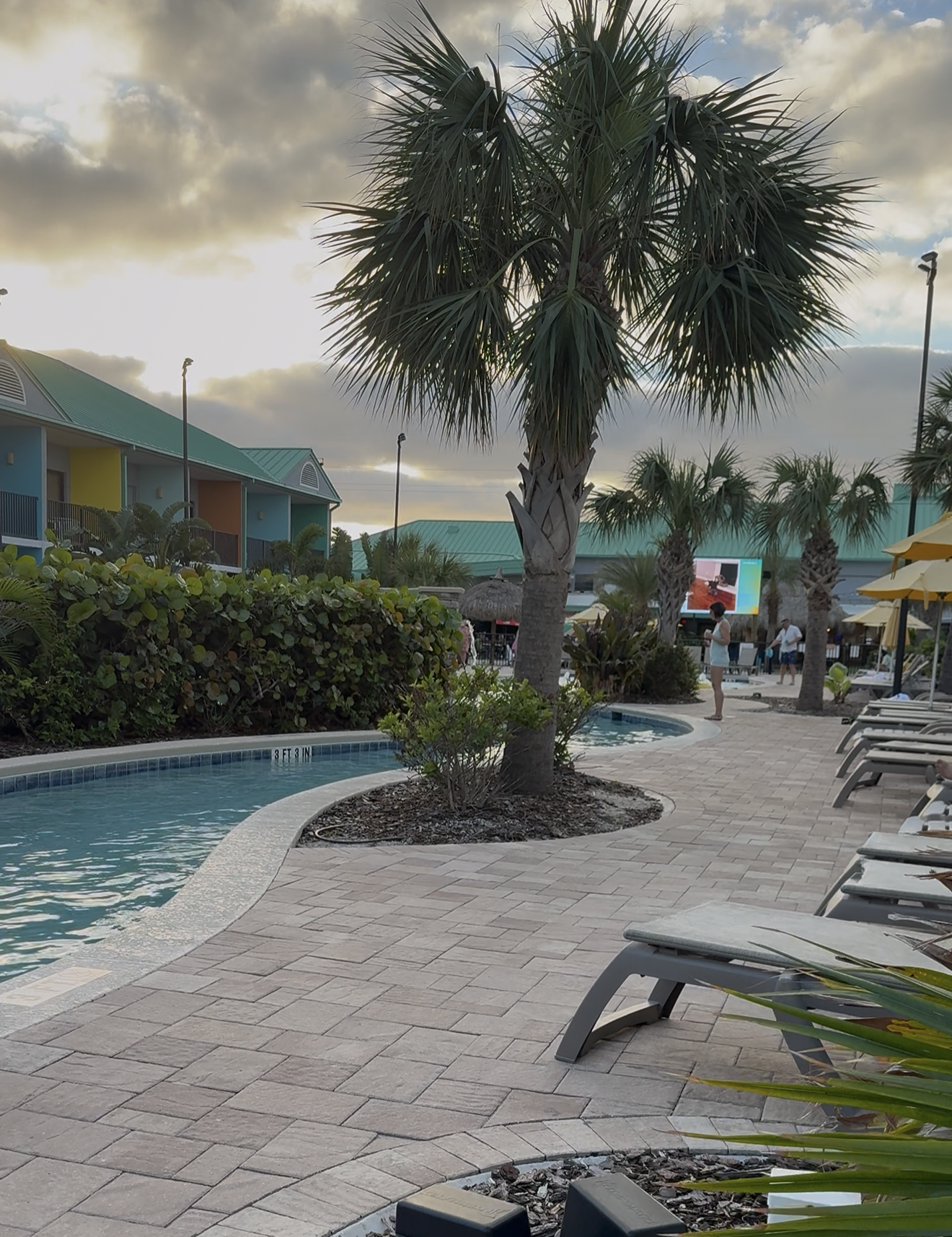 Beachside Hotel and Suites Cocoa Beach FL lazy river sunset.png
